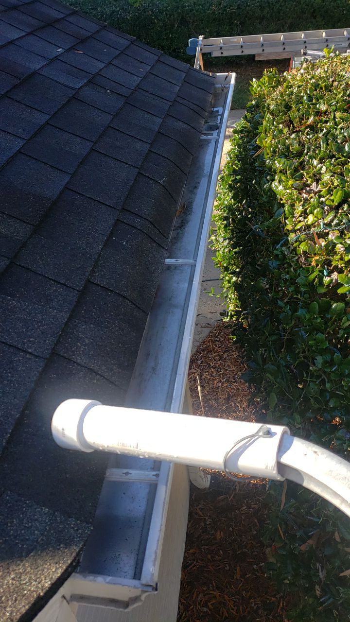 Sara Gutter cleanout using water by Power Wash Masters LLC