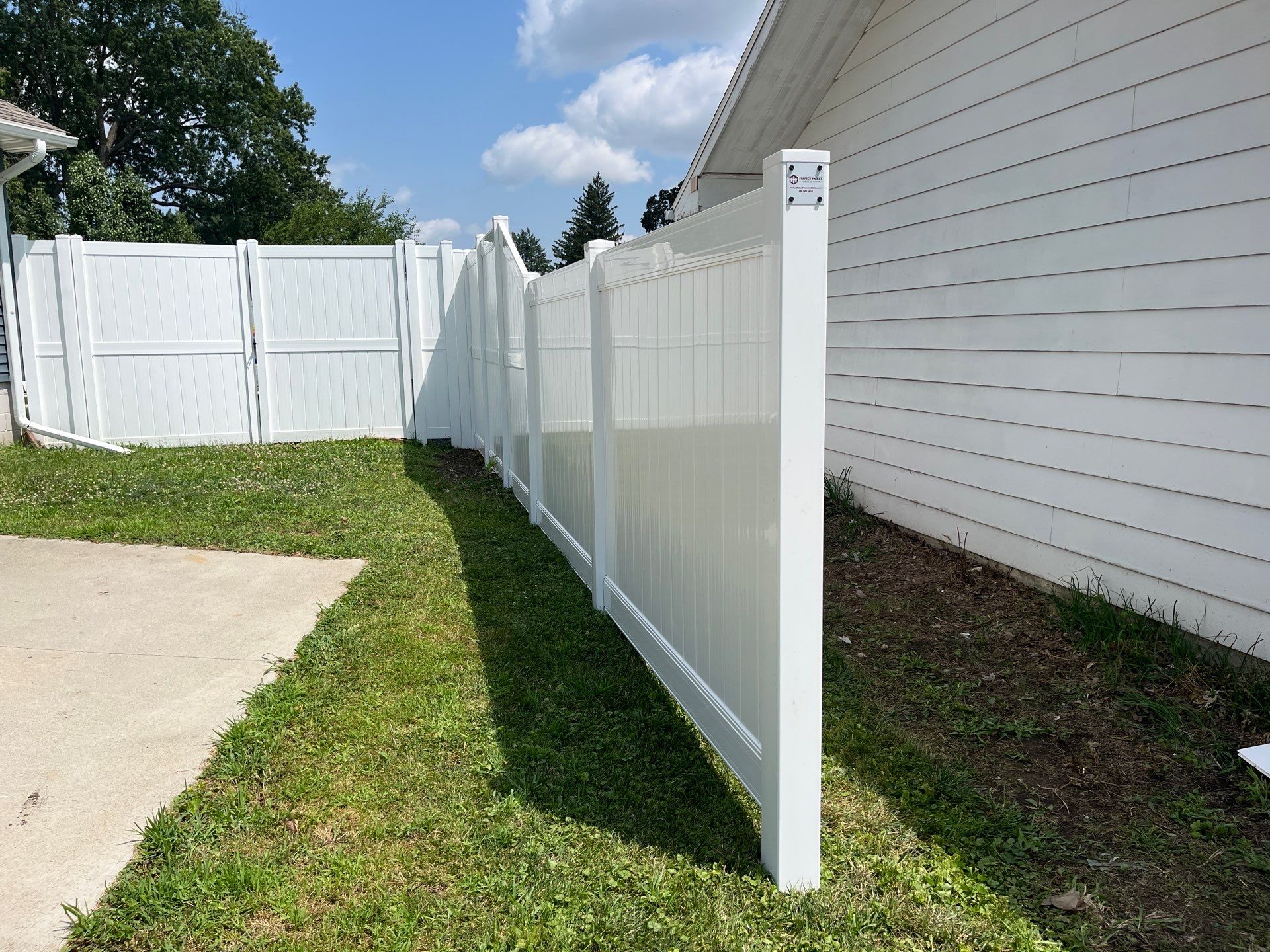 White Vinyl Privacy Fence Installation in Cedar Falls by Perfect Picket Fence and Stain