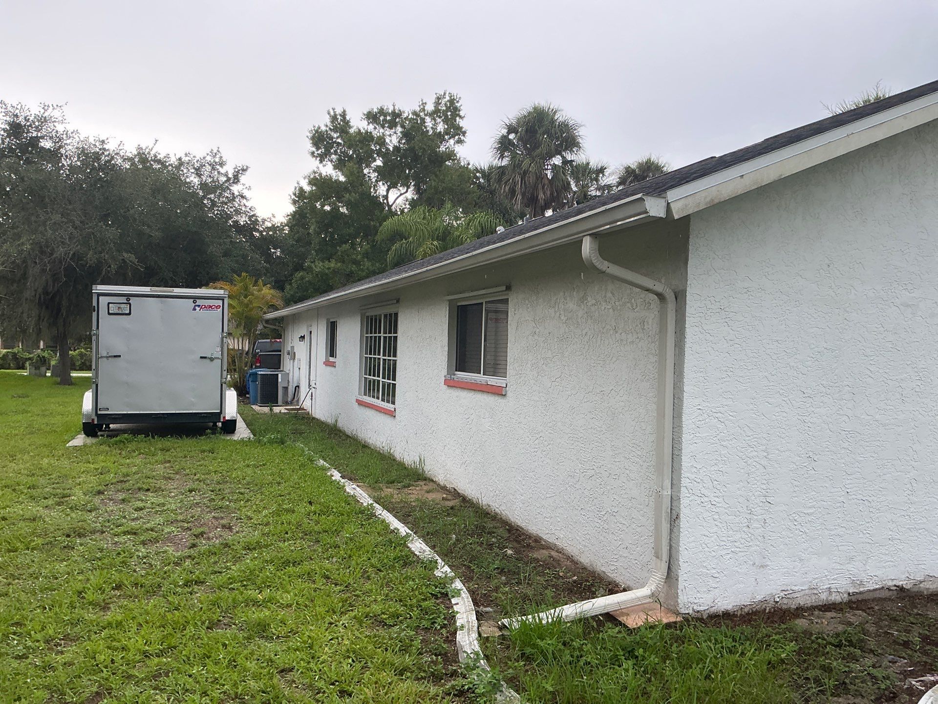 White Seamless Gutters with Splash Guards in North Fort Myers FL by Gutter Professor   by Gutter Professors