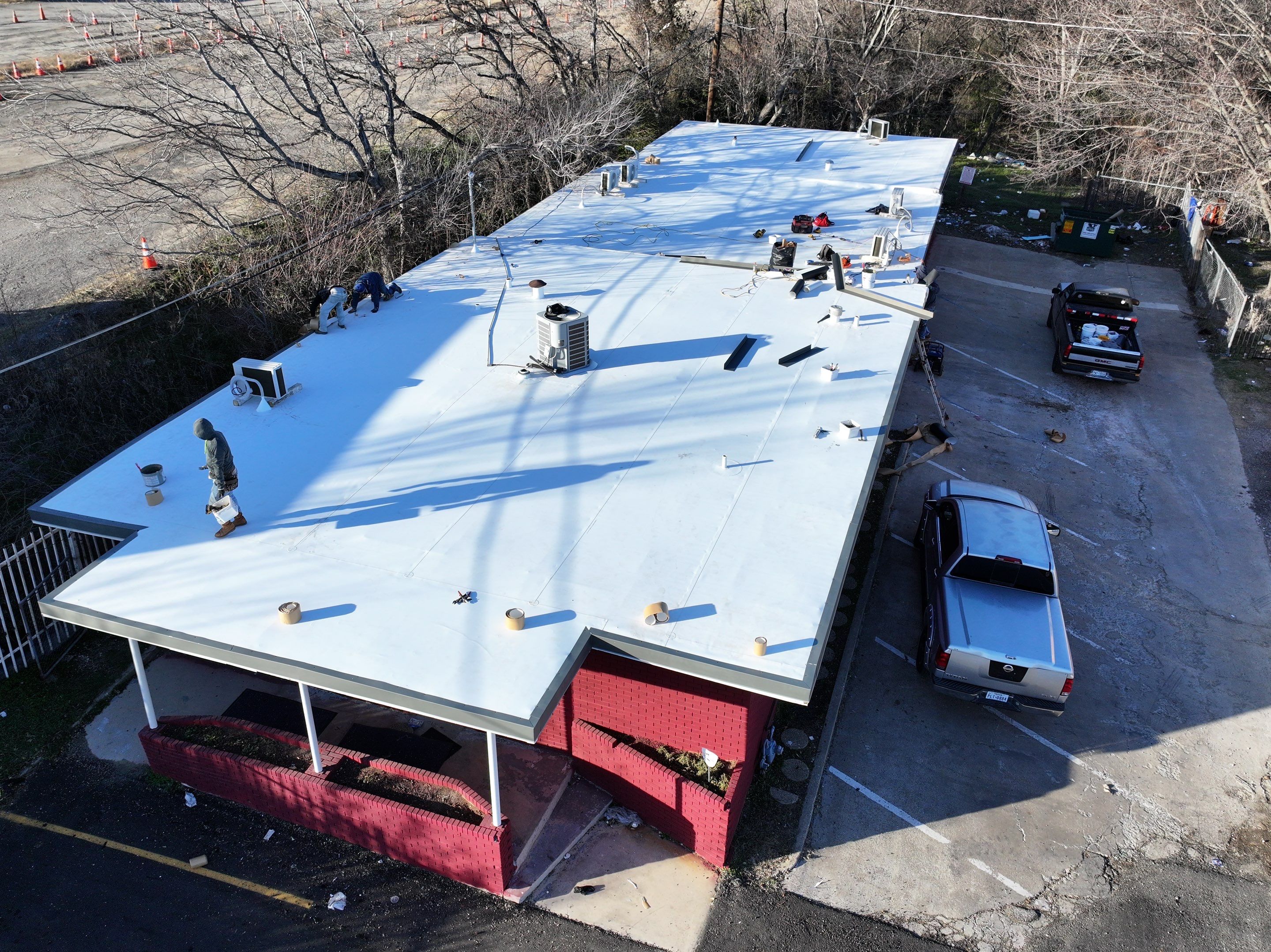 Commercial roofing overlay using GAF TPO over an old ballast roof by Becker Roofing and Exteriors