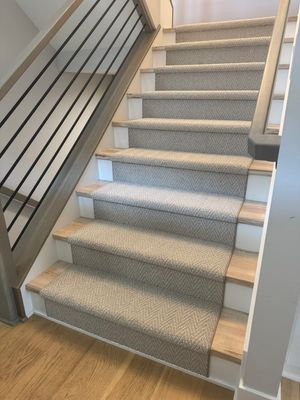 Fishers Staircase Renovation Featuring Custom Herringbone Runner and Modern Railing