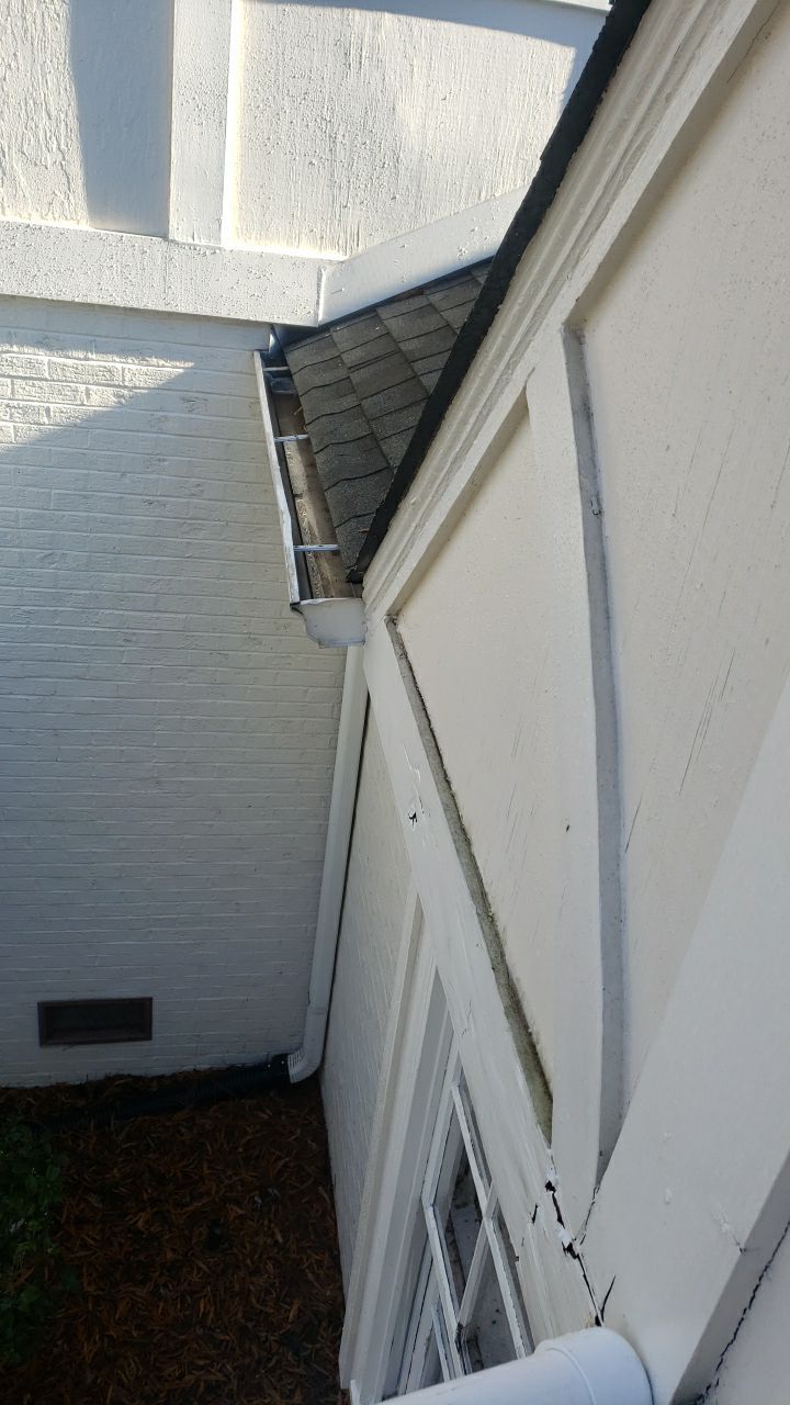 Sara Gutter cleanout using water by Power Wash Masters LLC