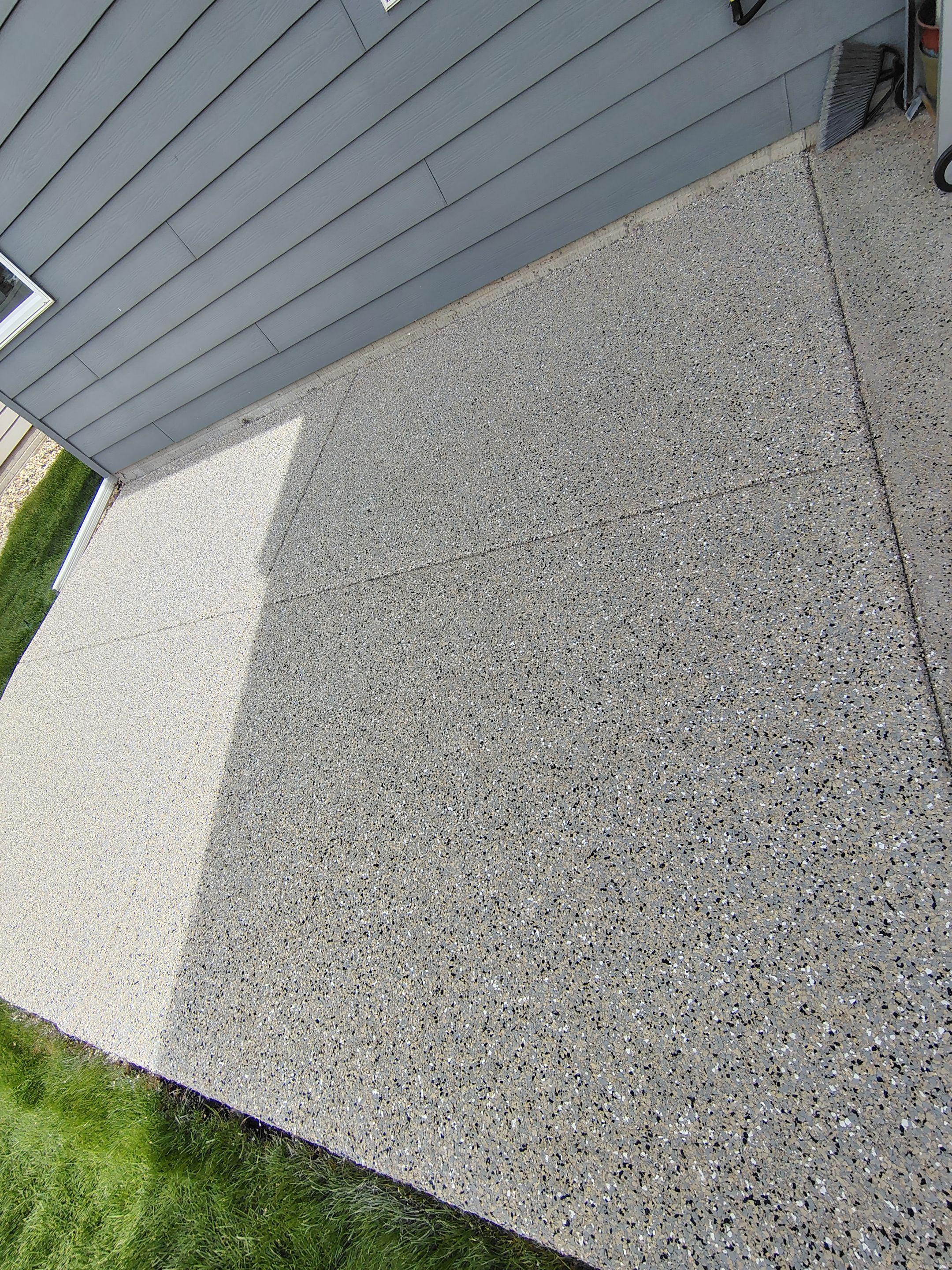 Speckled Concrete Patio Coating Installation in Sioux Falls by Select Painting, Coatings & Garage Cabinets