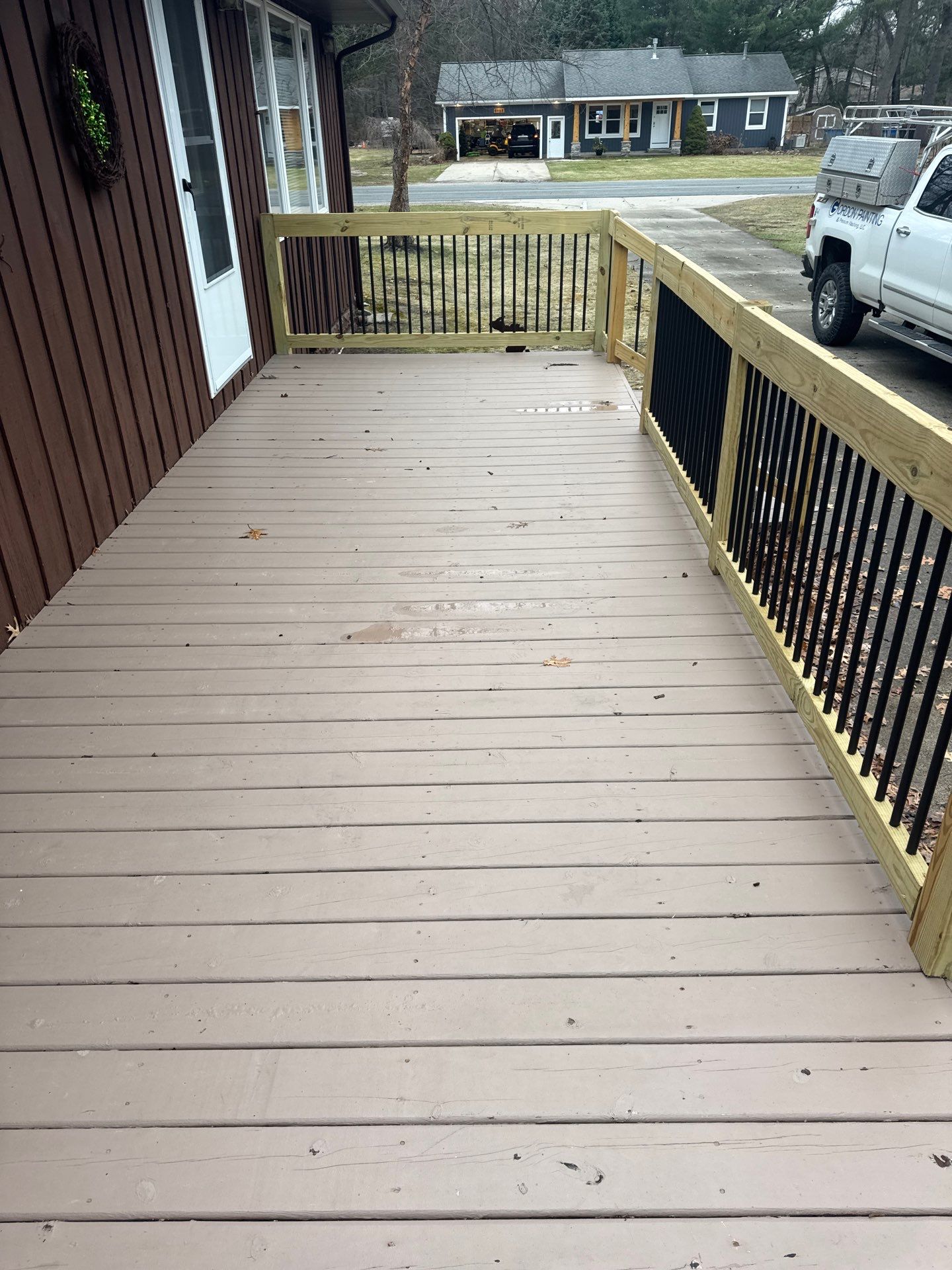 Muskegon Deck Restoration with Pressure Treated Railings and Wood Staining by Gordon Painting