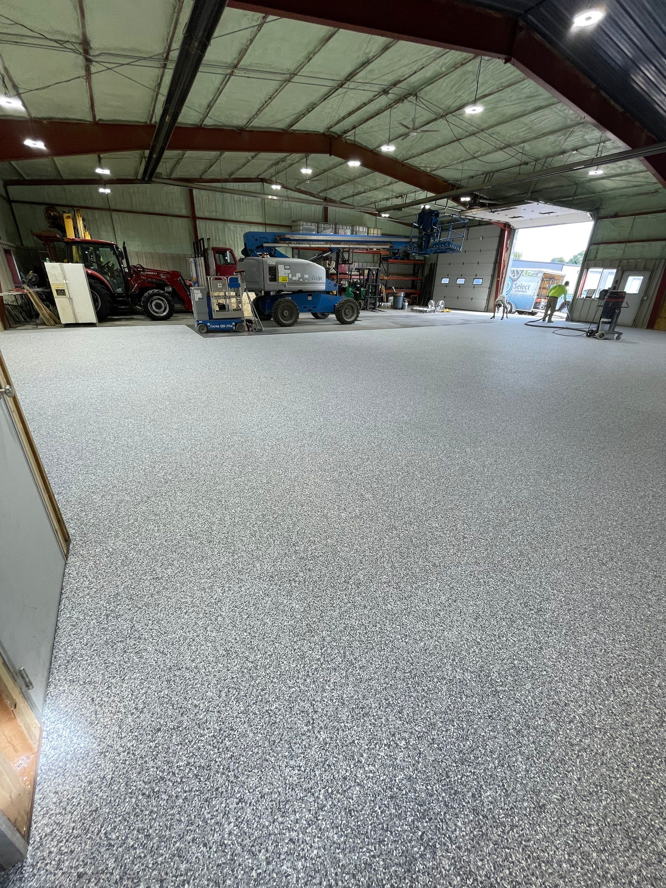 Custom Polyurea Shop Floor with Basketball Court Lines in Rock Valley by Select Painting, Coatings & Garage Cabinets