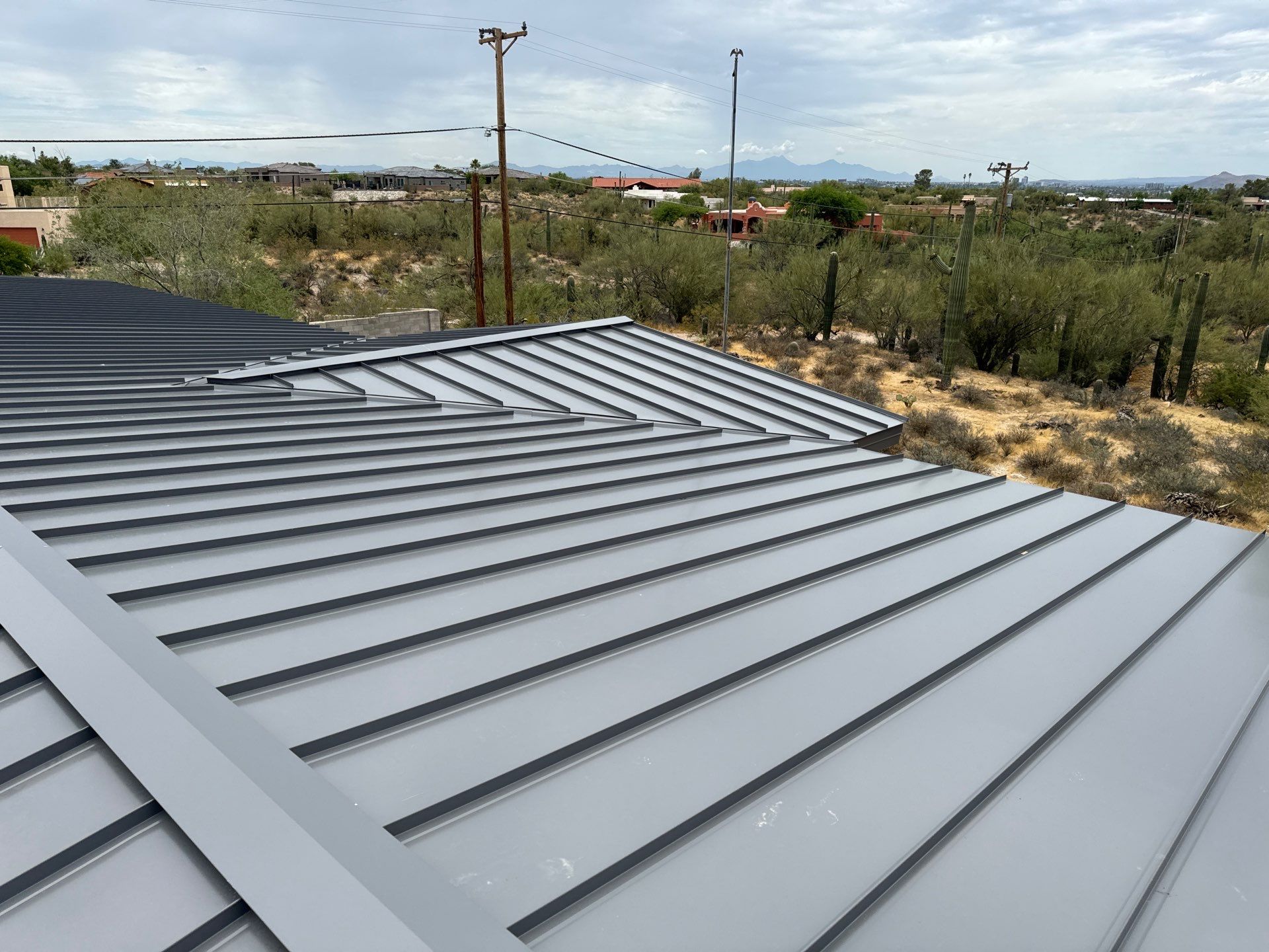 Charcoal Gray Standing Seam by Reimagine Roofing