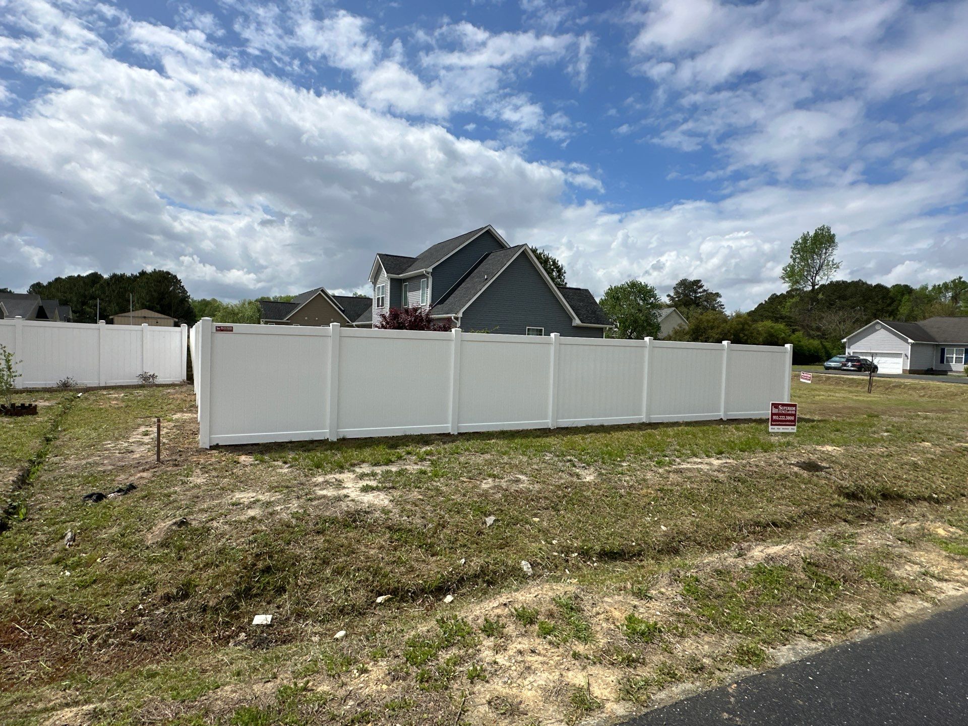 White Vinyl Privacy Fence Installation in Clinton by Superior Fence and Rail