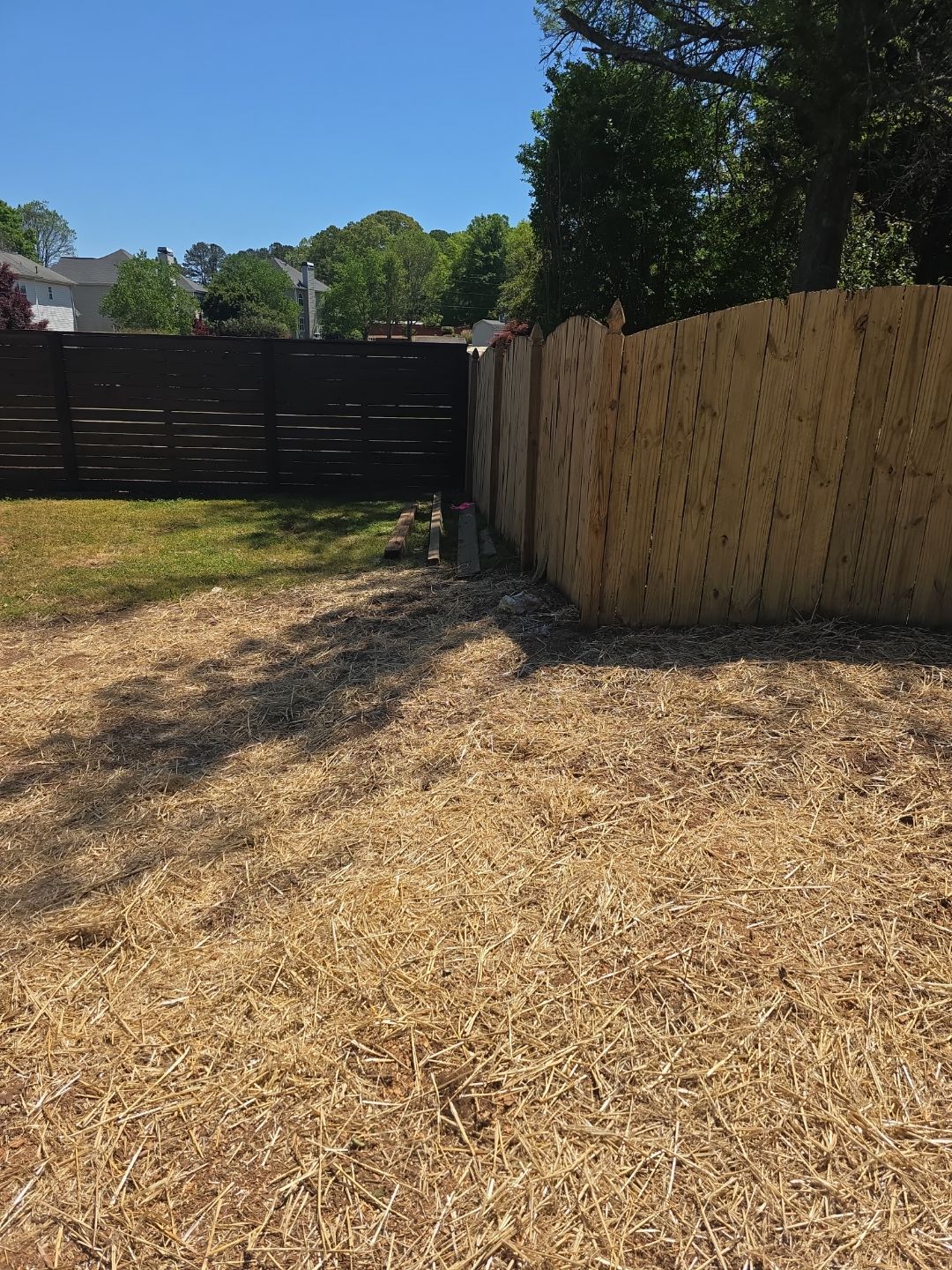 Fence Installation of a Capped Wood Privacy Fence by Titans of Timber Fence & Stain