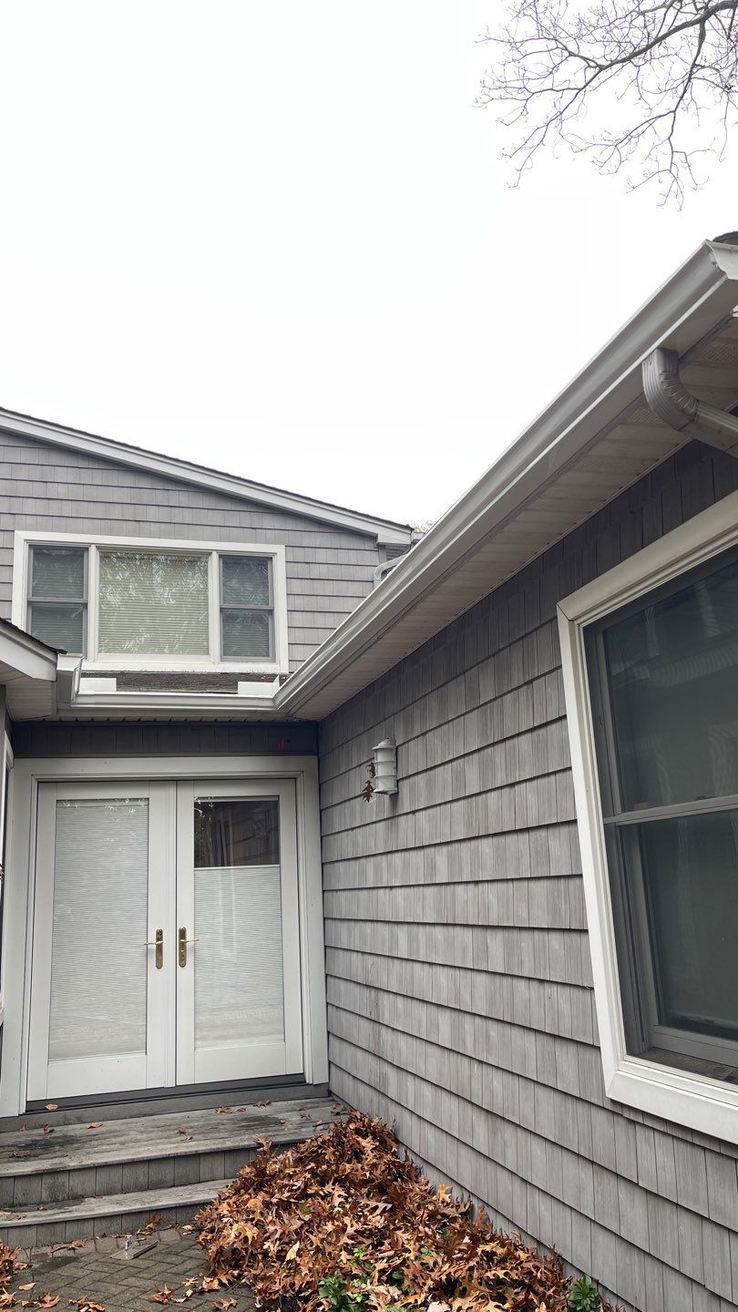 Gutter Installation using 5"white K style seamless gutters and 2x3 white leaders, and Microguard gutter shields installed.  by Above All Gutters 