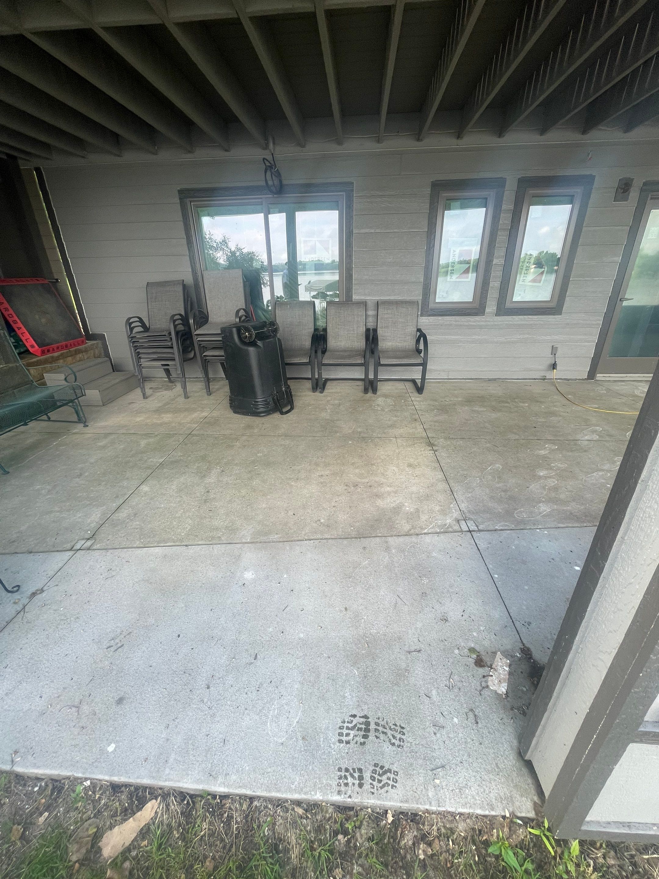 Lakefront Screened Patio Concrete Coating Installation in Wentworth by Select Painting, Coatings & Garage Cabinets