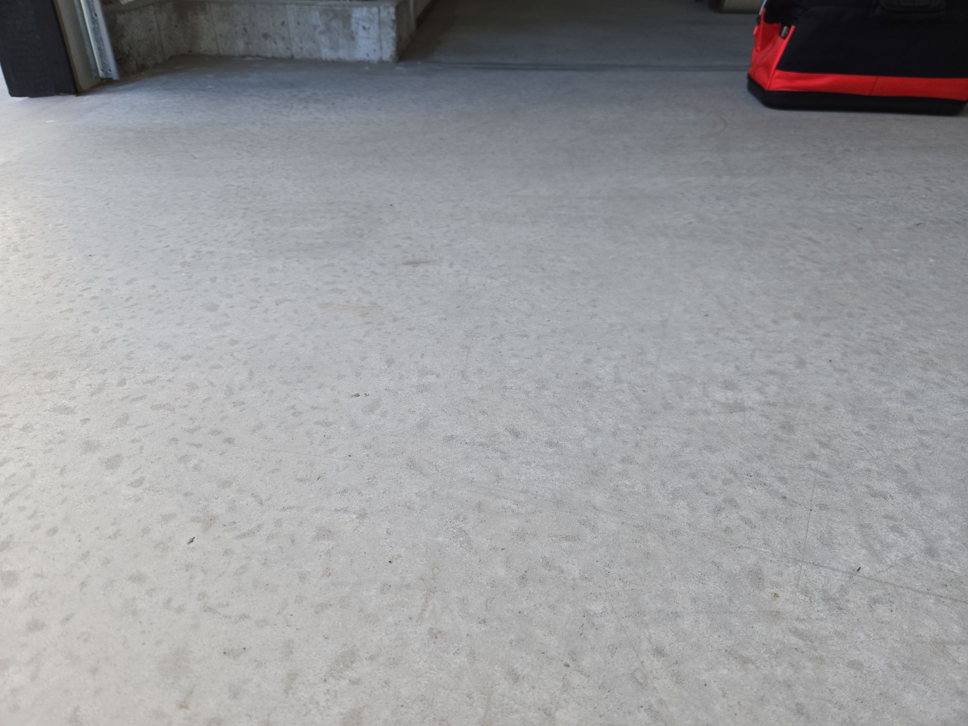 High-Gloss Epoxy Flake Garage Floor Coating in Brandon by Select Painting, Coatings & Garage Cabinets