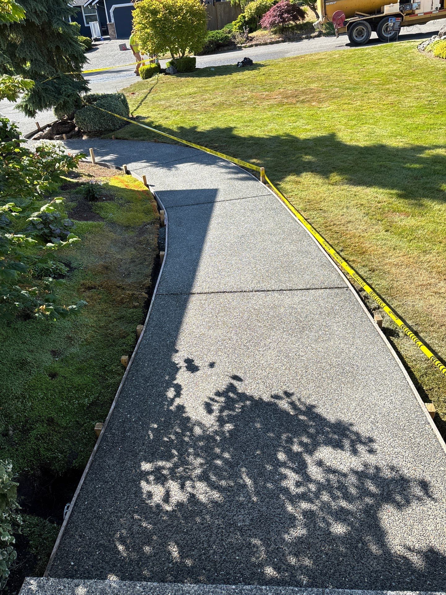 Exposed Aggregate Concrete Driveway Makeover  by Jireh Asphalt & Concrete Inc 