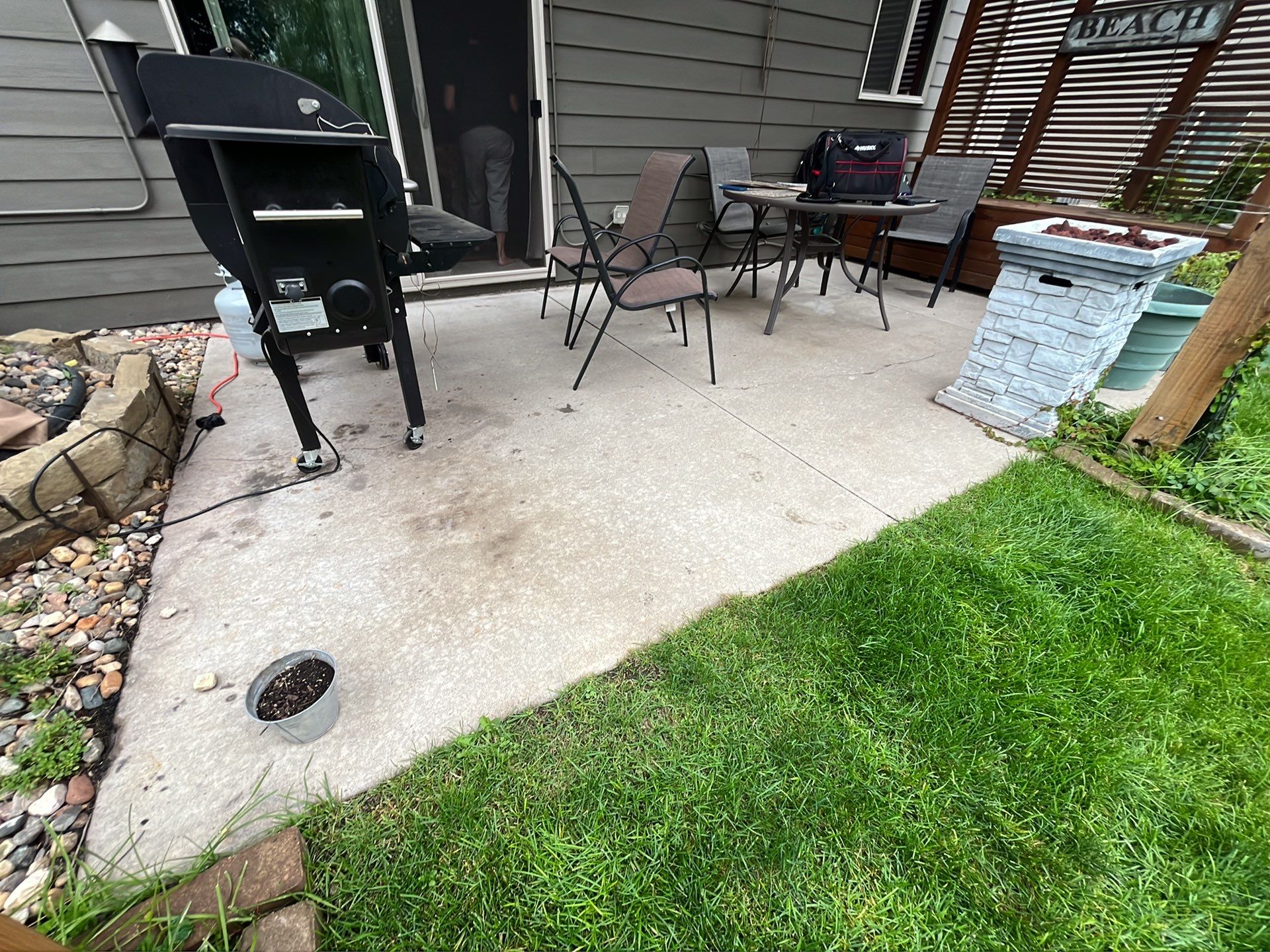 Coyote Flake Concrete Coating for Sioux Falls Patio by Select Painting, Coatings & Garage Cabinets