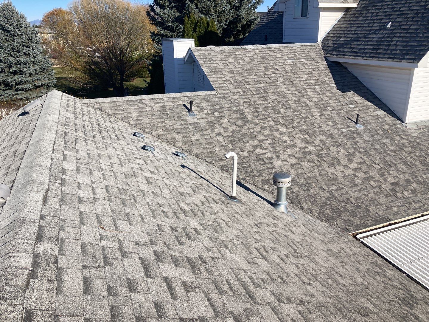 Two story farmhouse style roofing installation using Owens Corning Duration in the color Teak by ID Roofing LLC