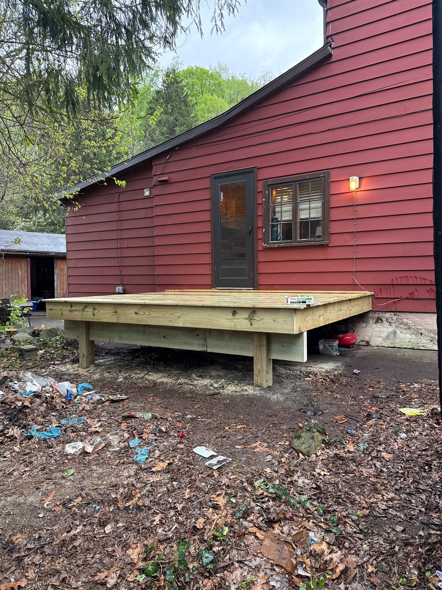 Roof sunspace deck  by Cousins Roofing Siding & Decks