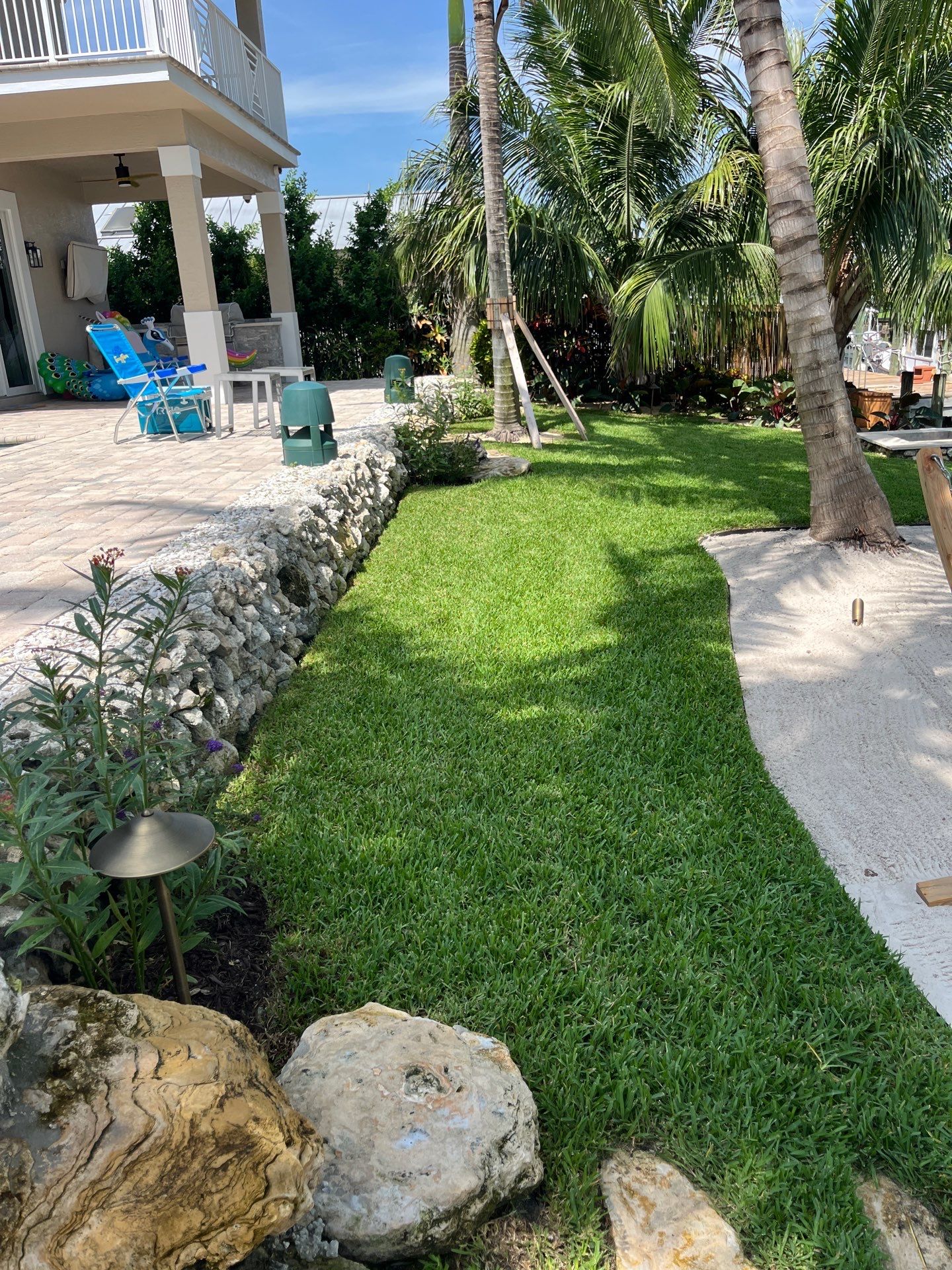 “Tropical Oasis Transformation in Palm City” by Alpha Zeta Enterprises Inc