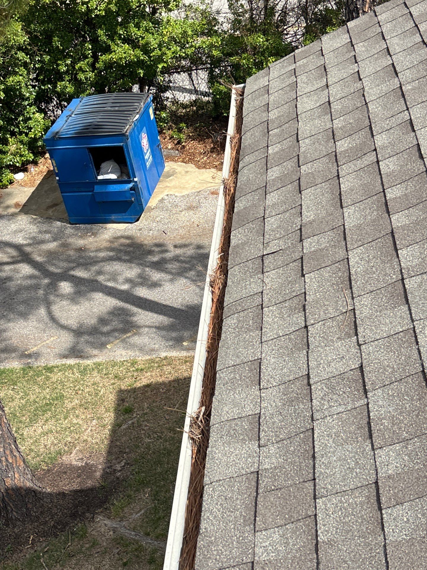 Commercial gutter cleaning Memphis, TN before photo with filled gutters
