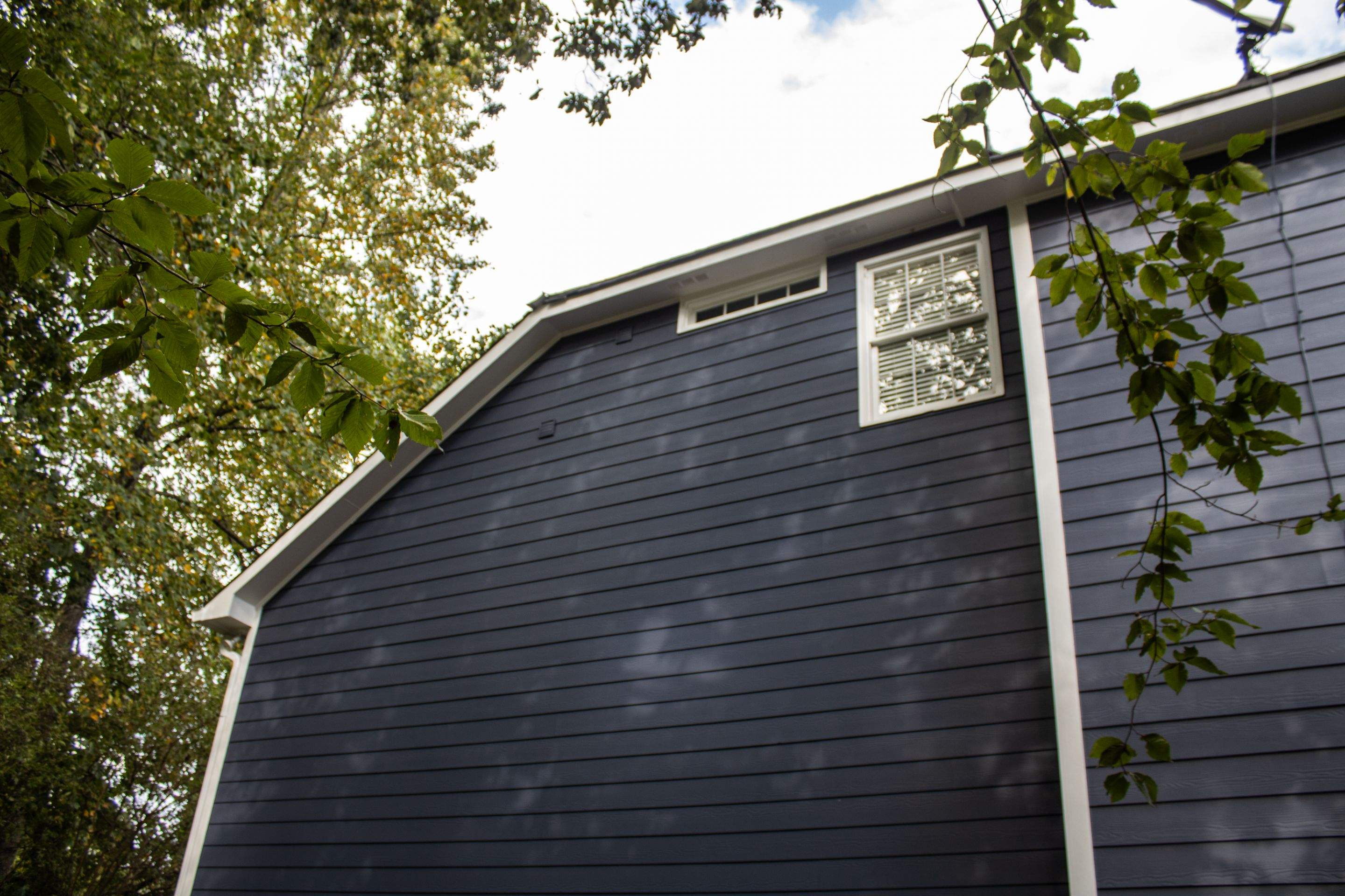 Blue Exterior Paint and Siding Installation using James Hardie Lap Siding by Nelson Exteriors