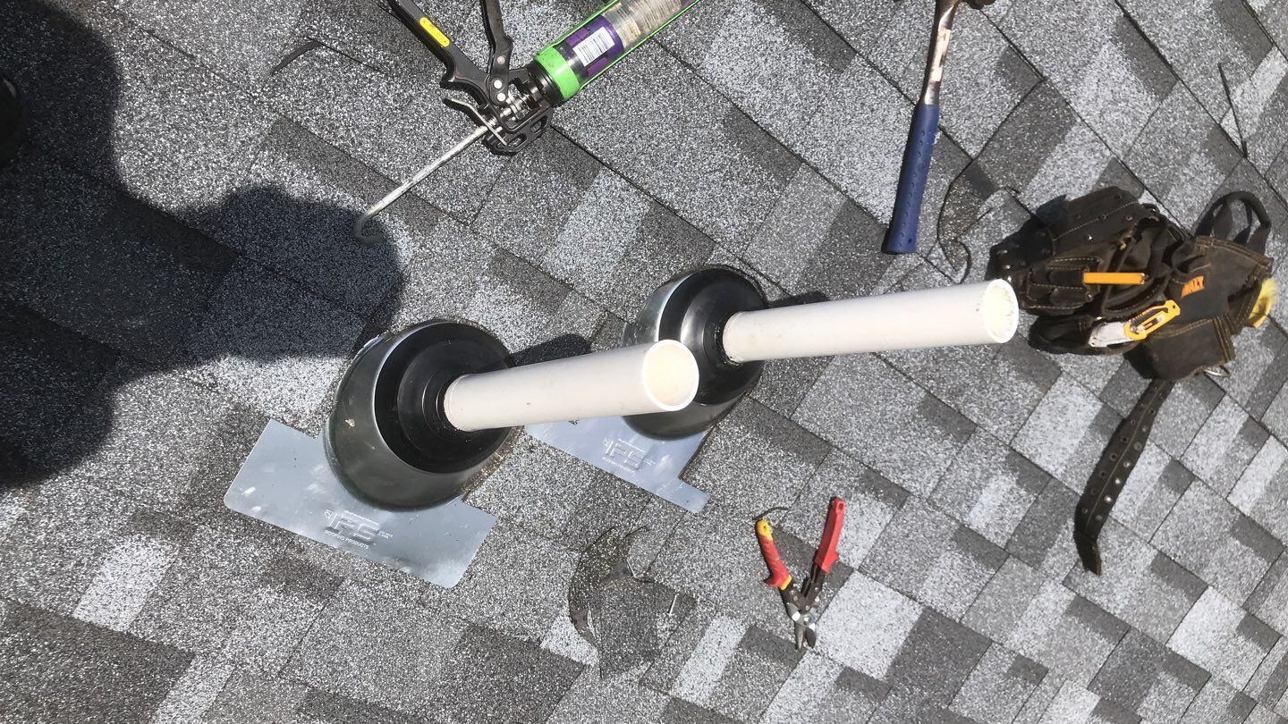 Commercial Roofing Installation using EPDM with white gutters by A Plus Exterior