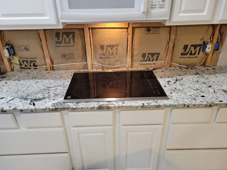 Kitchen countertops using White Normandy Granite by Mena stone surfaces