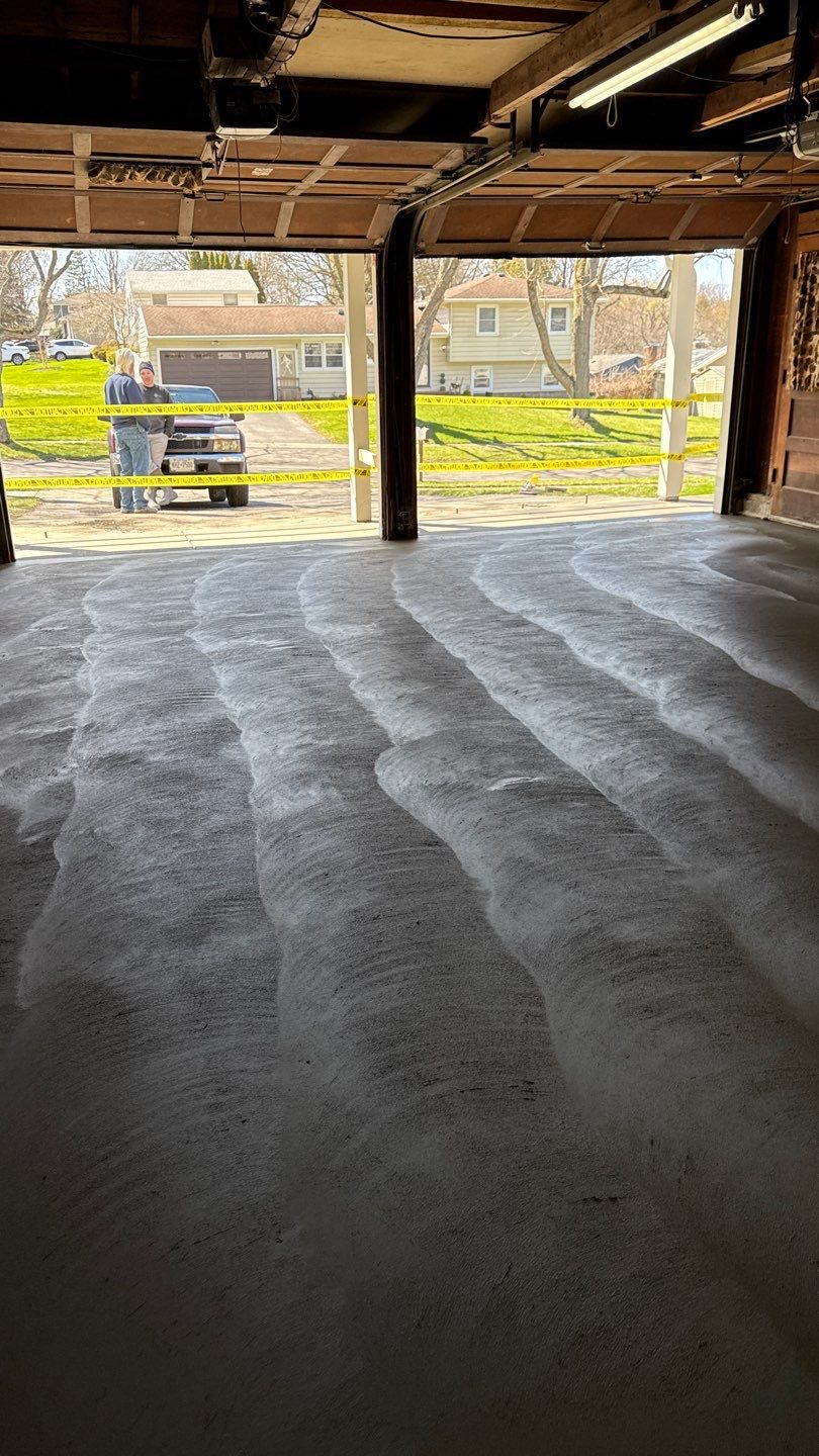 Concrete garage floor replacement with a broom finished apron and sidewalk  by NG Masonry & Construction LLC