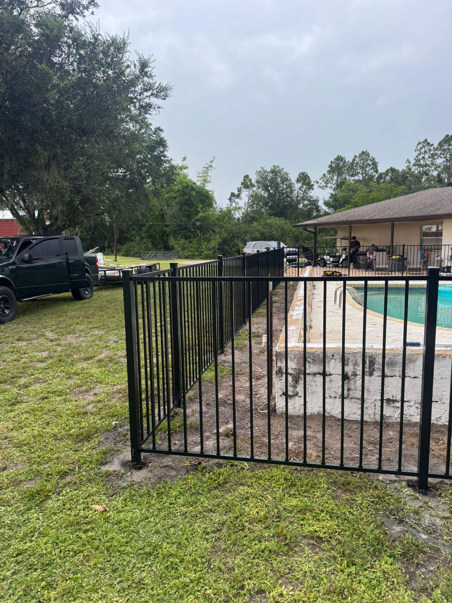 Black Aluminum Pool Safety Fence Installation in Punta Gorda by True Fence LLC