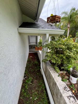 White Seamless Gutters with Splash Guards in North Fort Myers FL by Gutter Professor  
