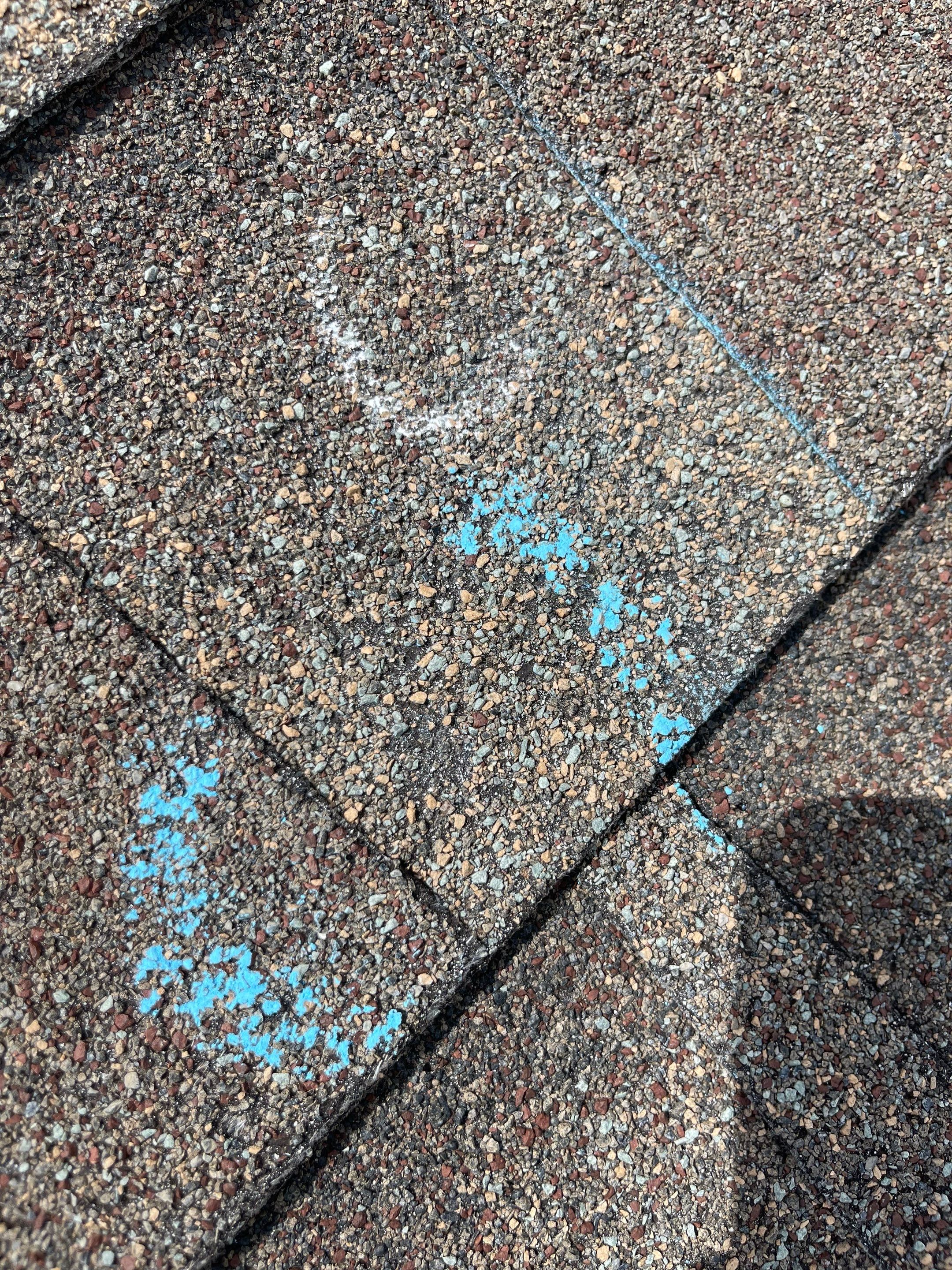 Hail Damage on a Roofing System by Icon Roofing And Construction 