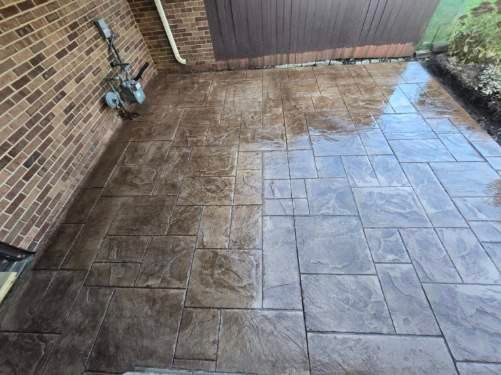 Stamped concrete and redeck  by Cousins Roofing Siding & Decks