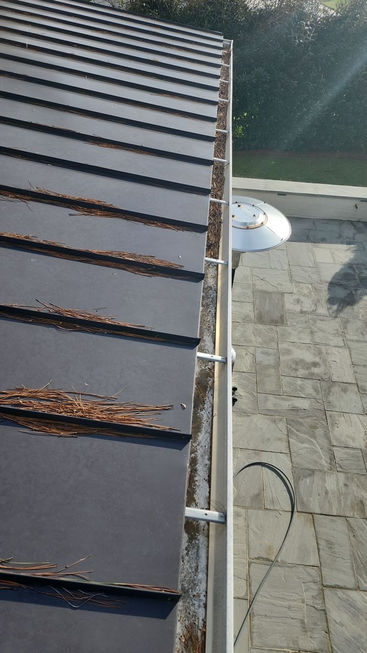 Gutter Cleaning using water by Power Wash Masters LLC