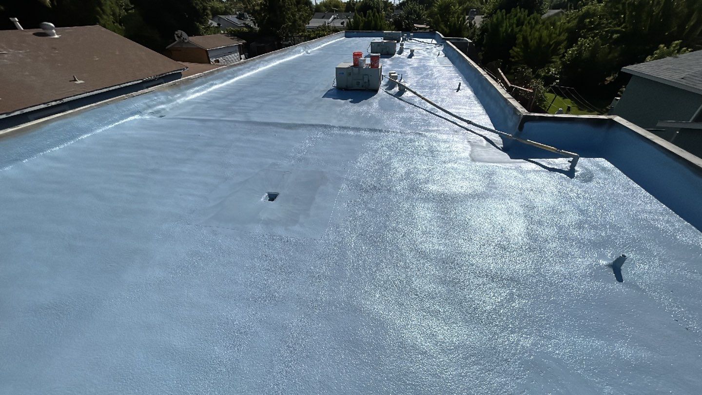 Foam Refurbish using Conklin Benchmark/PUMA XL coatings and spray foam; Also metal roofing around parapet wall by Straight Edge Roofing Inc