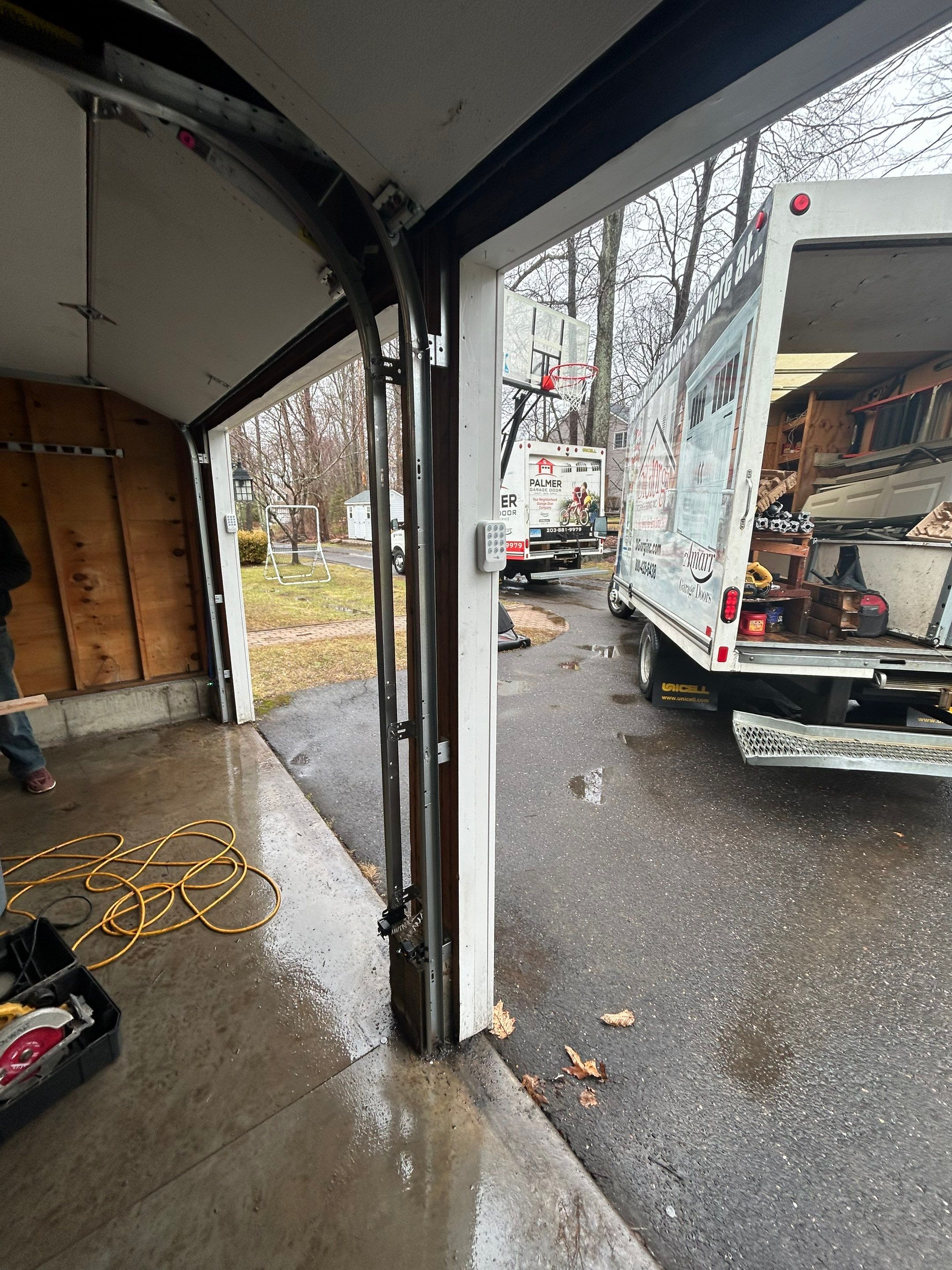 Modern Triple Garage Door Upgrade by DiGiorgi Roofing and Siding Inc