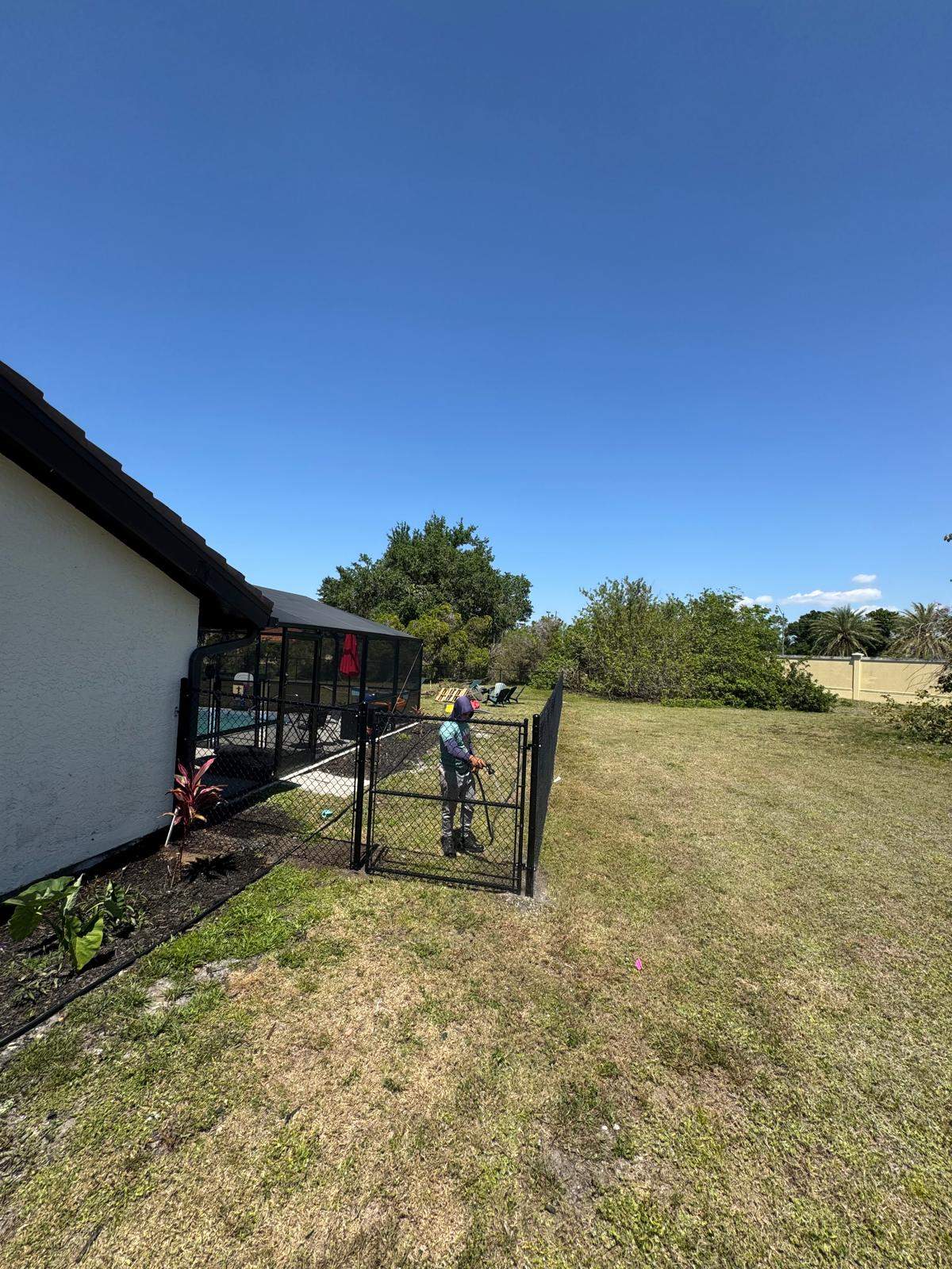 Black Chain Link Residential Backyard Fence Installation in North Port by True Fence LLC