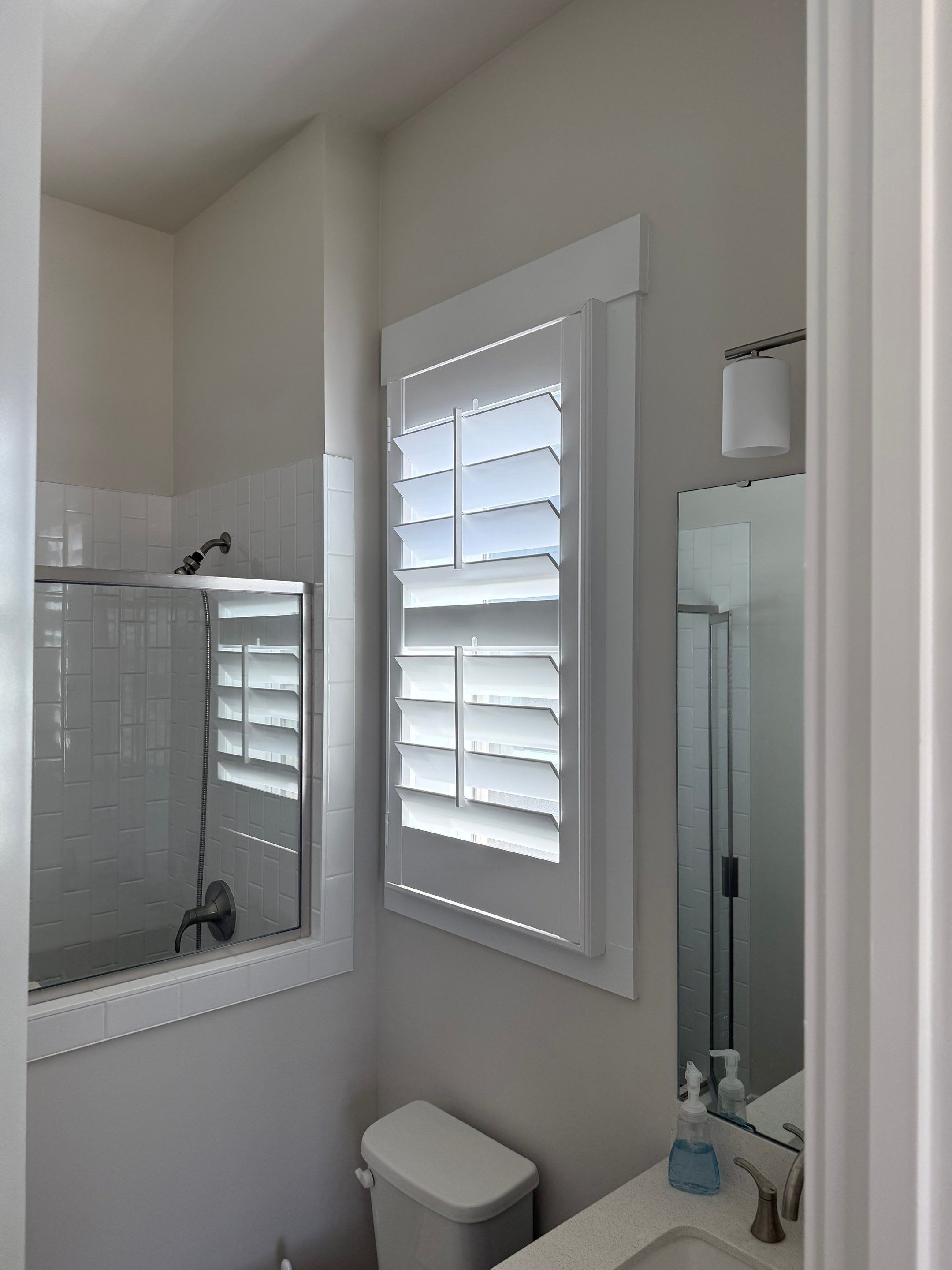 Whole Home Interior Shutter and Roller Shade Installation in Charlotte by Southern Traditions Window Fashions