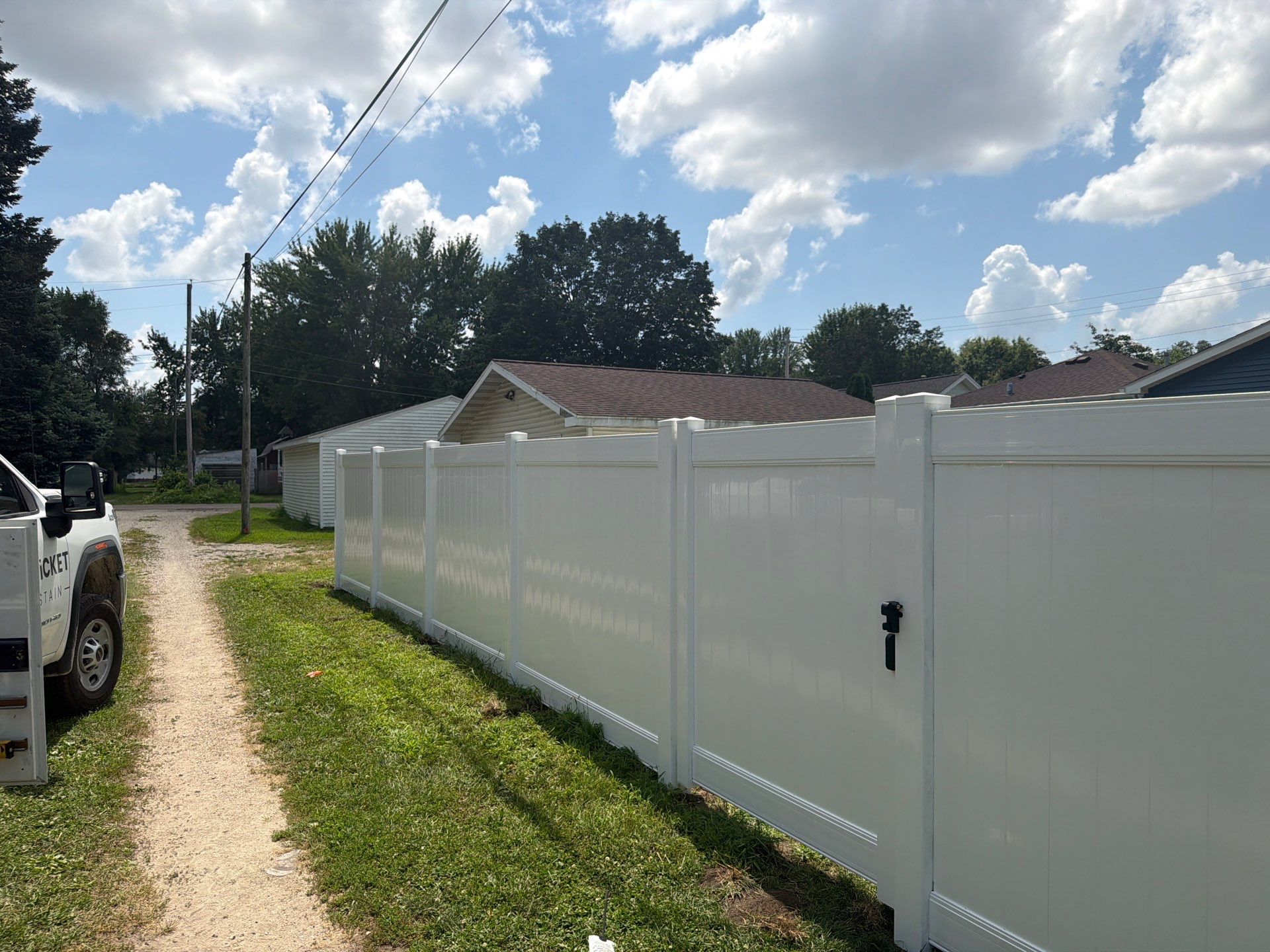 White Vinyl Privacy Fence Installation in Waterloo, Iowa by Perfect Picket Fence and Stain
