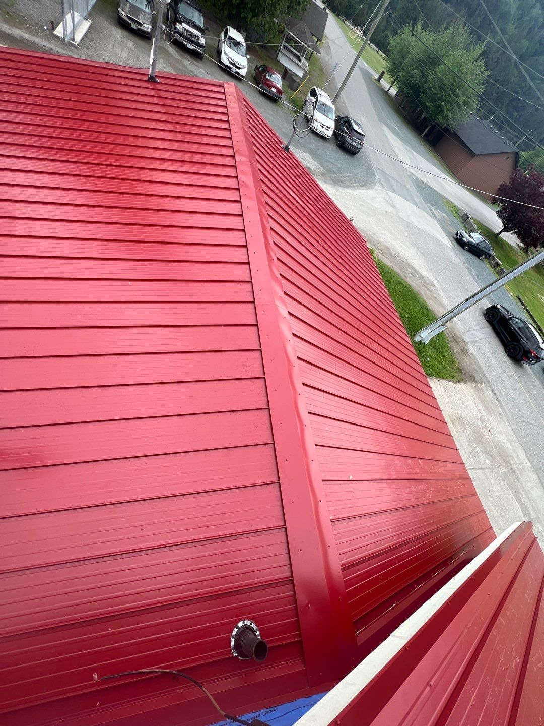Commercial Roofing Installation using 12" Prolok metal by Top Notch Roofing Inc