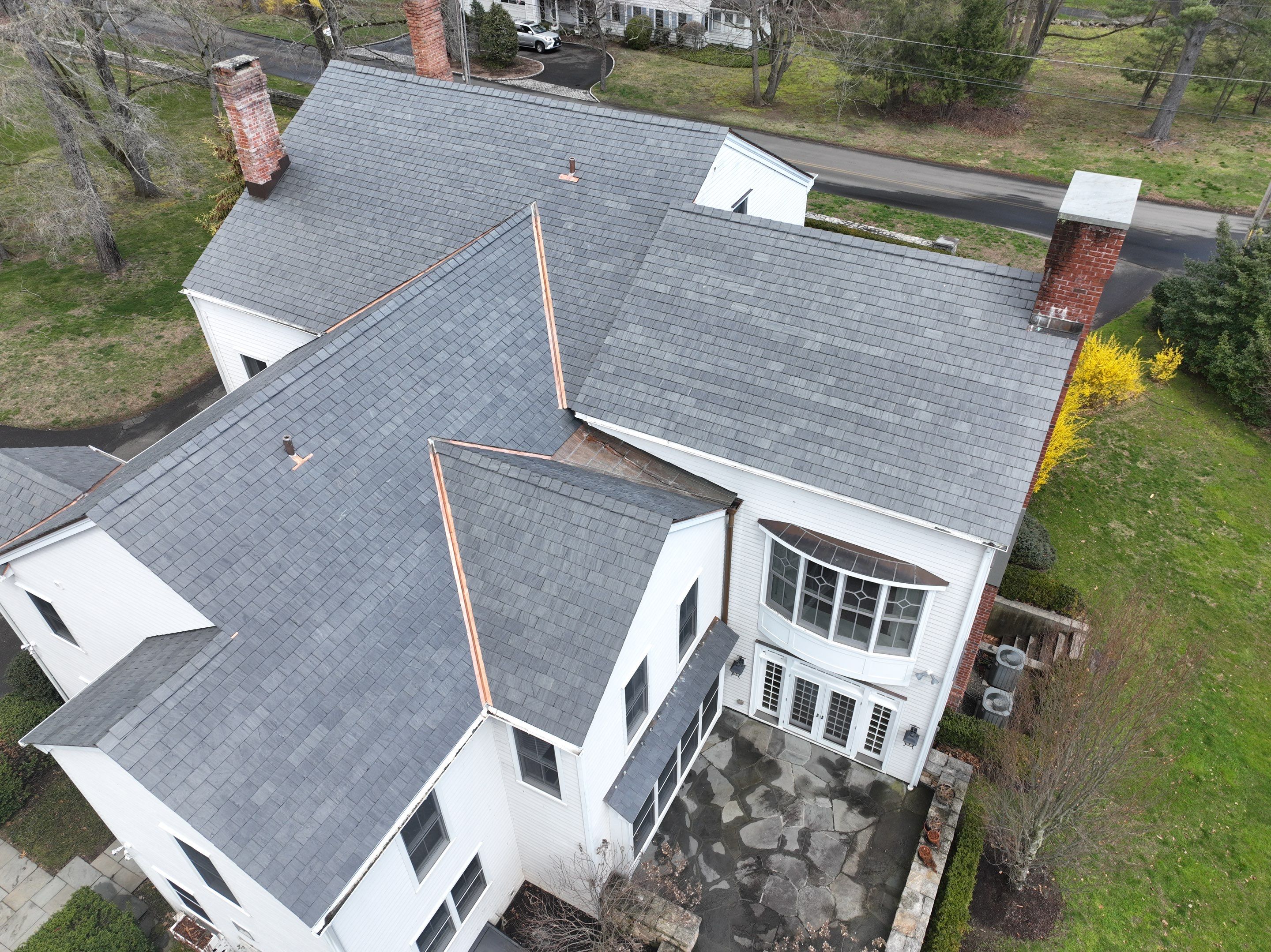 Residential Roofing Installation using Vermont Slate by A Plus Exterior