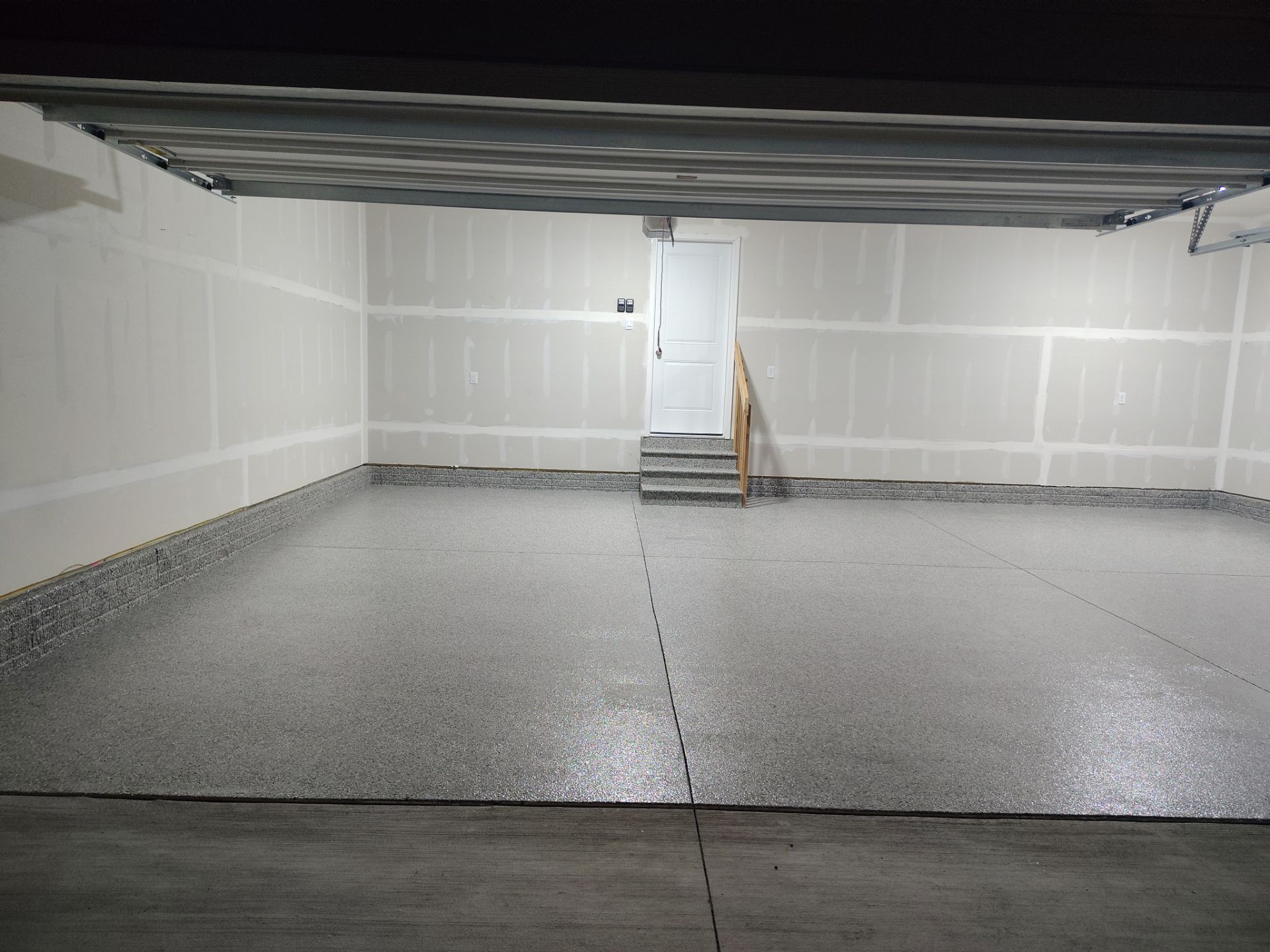 Adel, IA Garage: Complete Keystone Wrap on Floors, Stairs, and Stem Walls by Revival Concrete Coatings