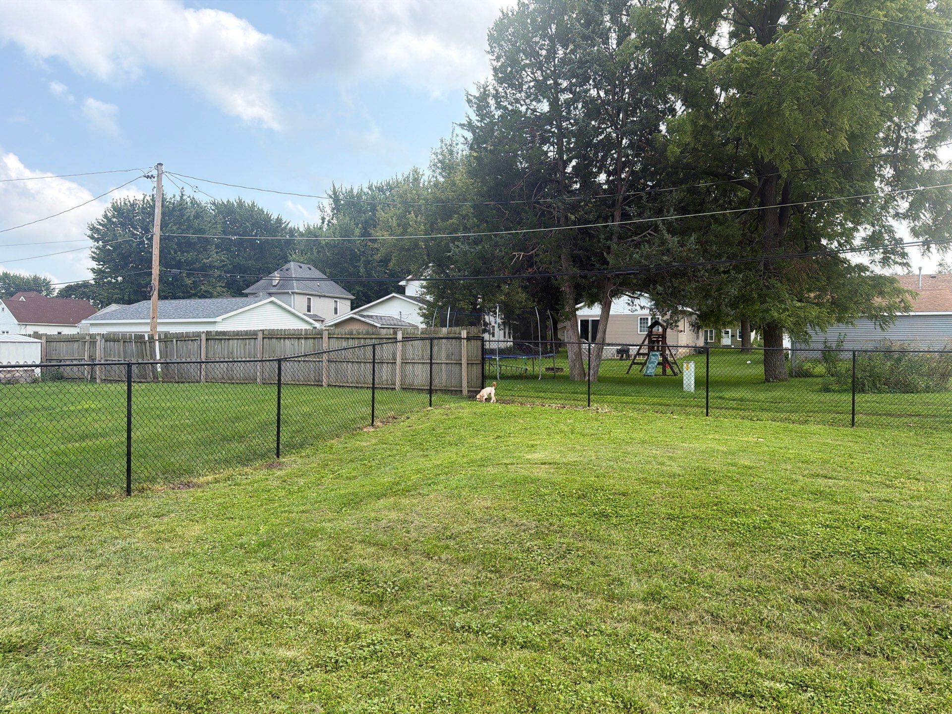 Residential Black Chain Link Fence Installation in Reinbeck by Perfect Picket Fence and Stain