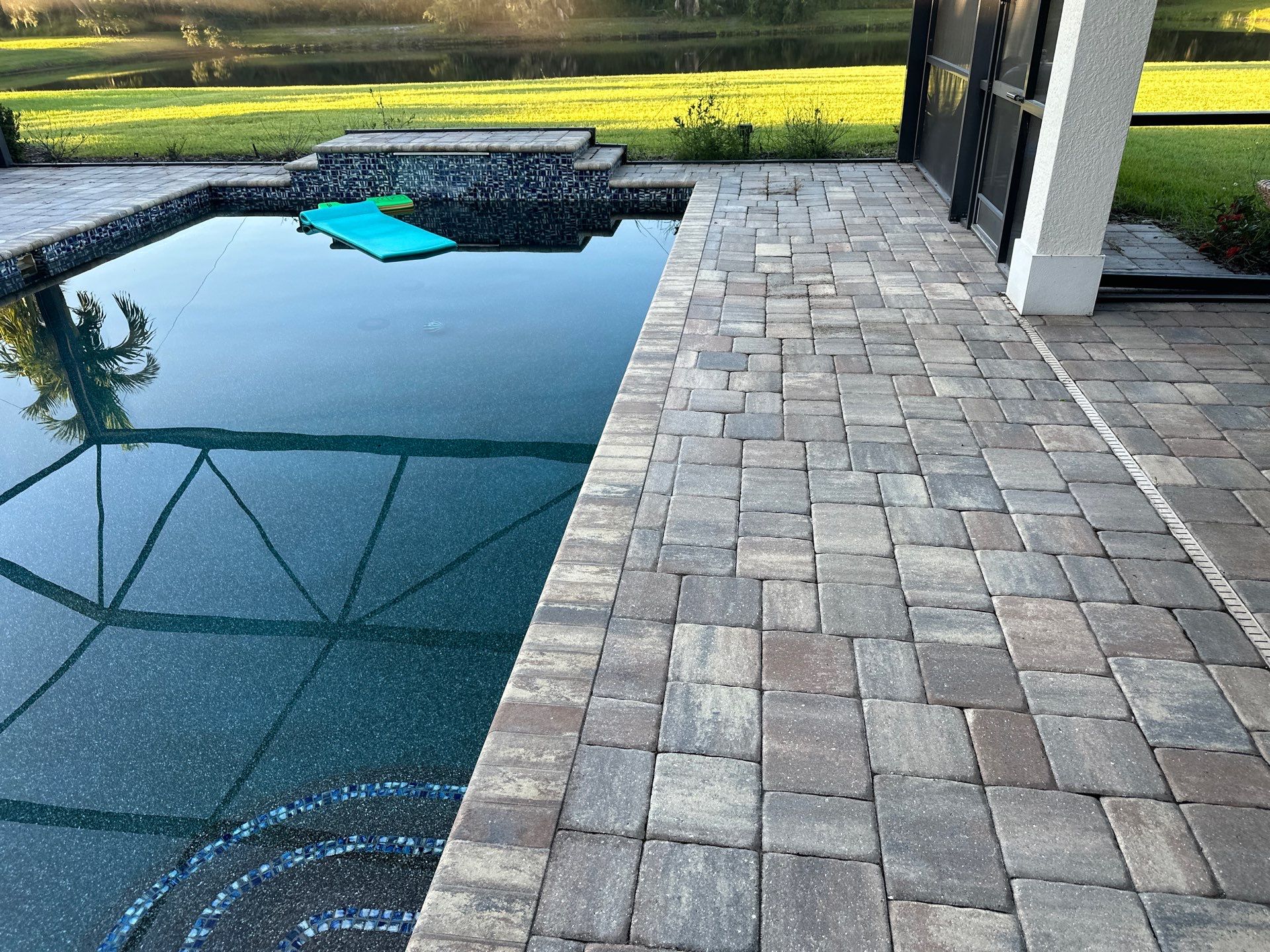 Paver Driveway, Sidewalk, and Pool Deck Cleaning in Winding River Community, Bradenton, FL by Sunshine AquaWash