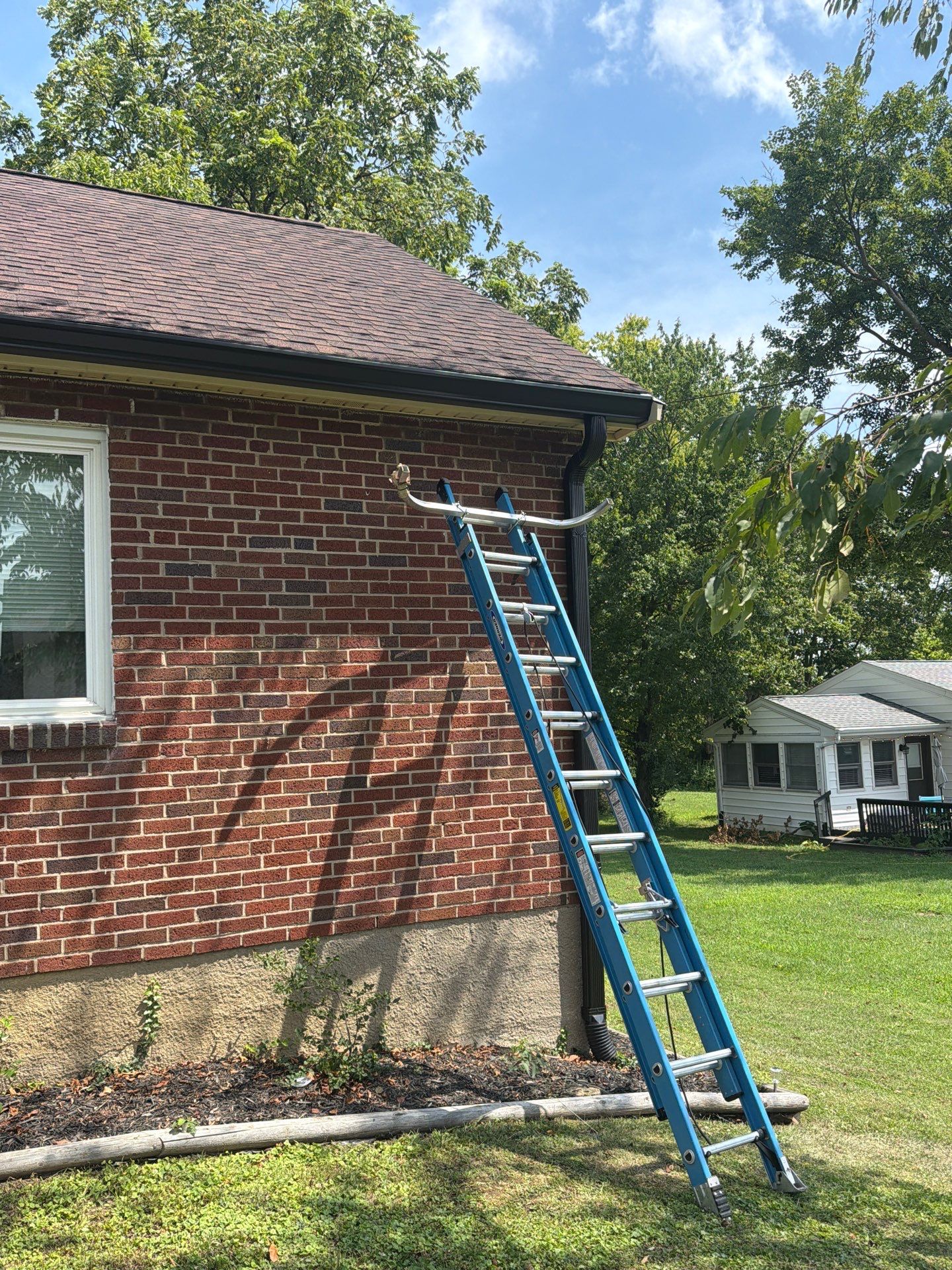 Seamless Black Gutter Installation for Cincinnati Brick Ranch Home by Agc Cincy