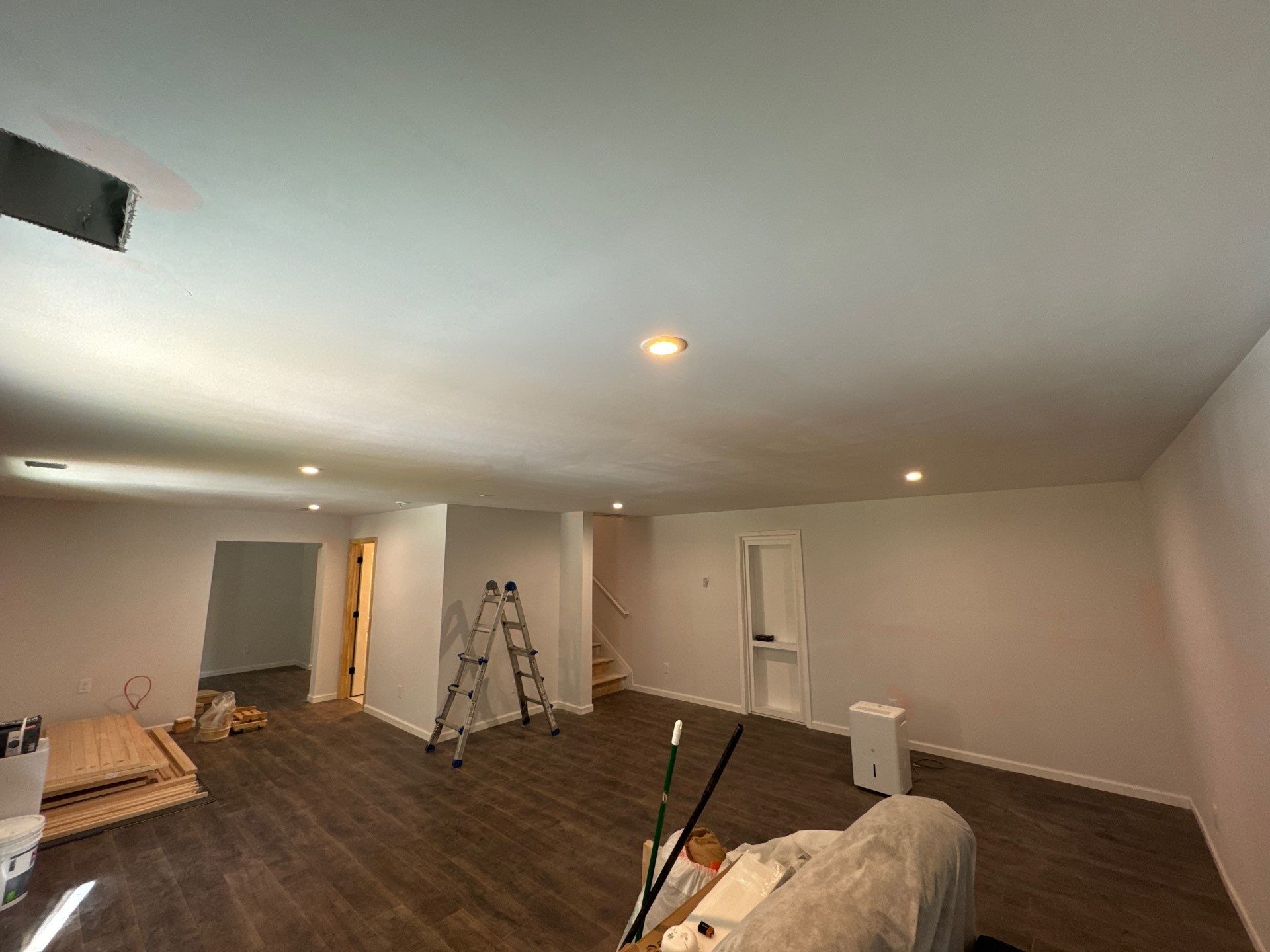Finished Basement in Acworth Featuring a Full Bathroom and Bar by Swift Home Renovations