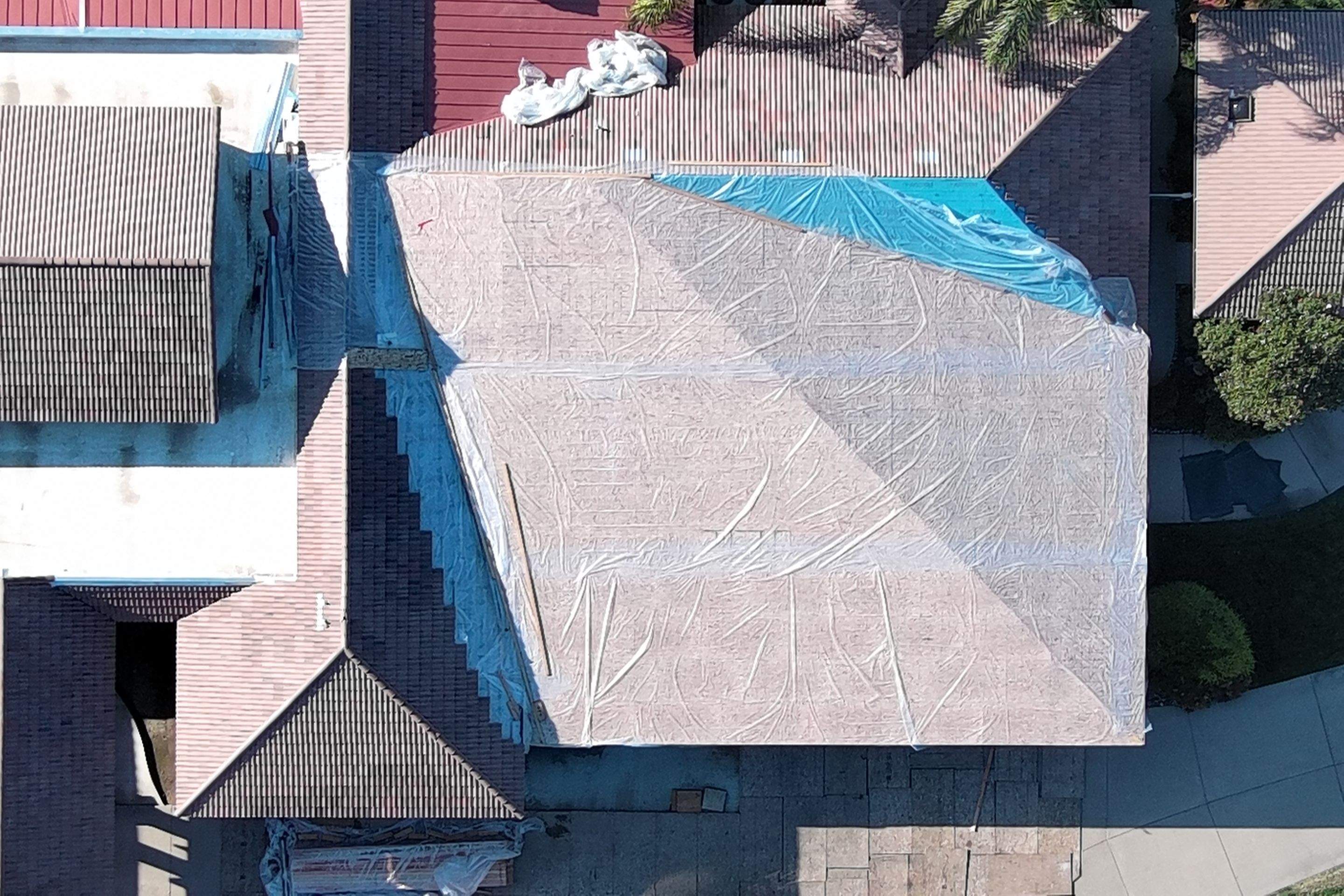 Tile, Metal, and TPO roofing project (new construction) by Straight Edge Roofing Inc