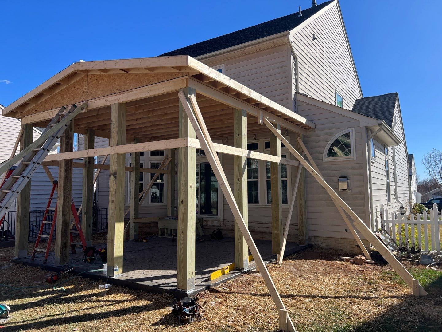 Custom Screened-In Porch with Stamped Concrete Patio in Warrenton by Jakari Restoration & Construction LLC