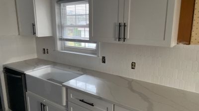 Kitchen Backsplash and Herringbone Tile Floor Remodel