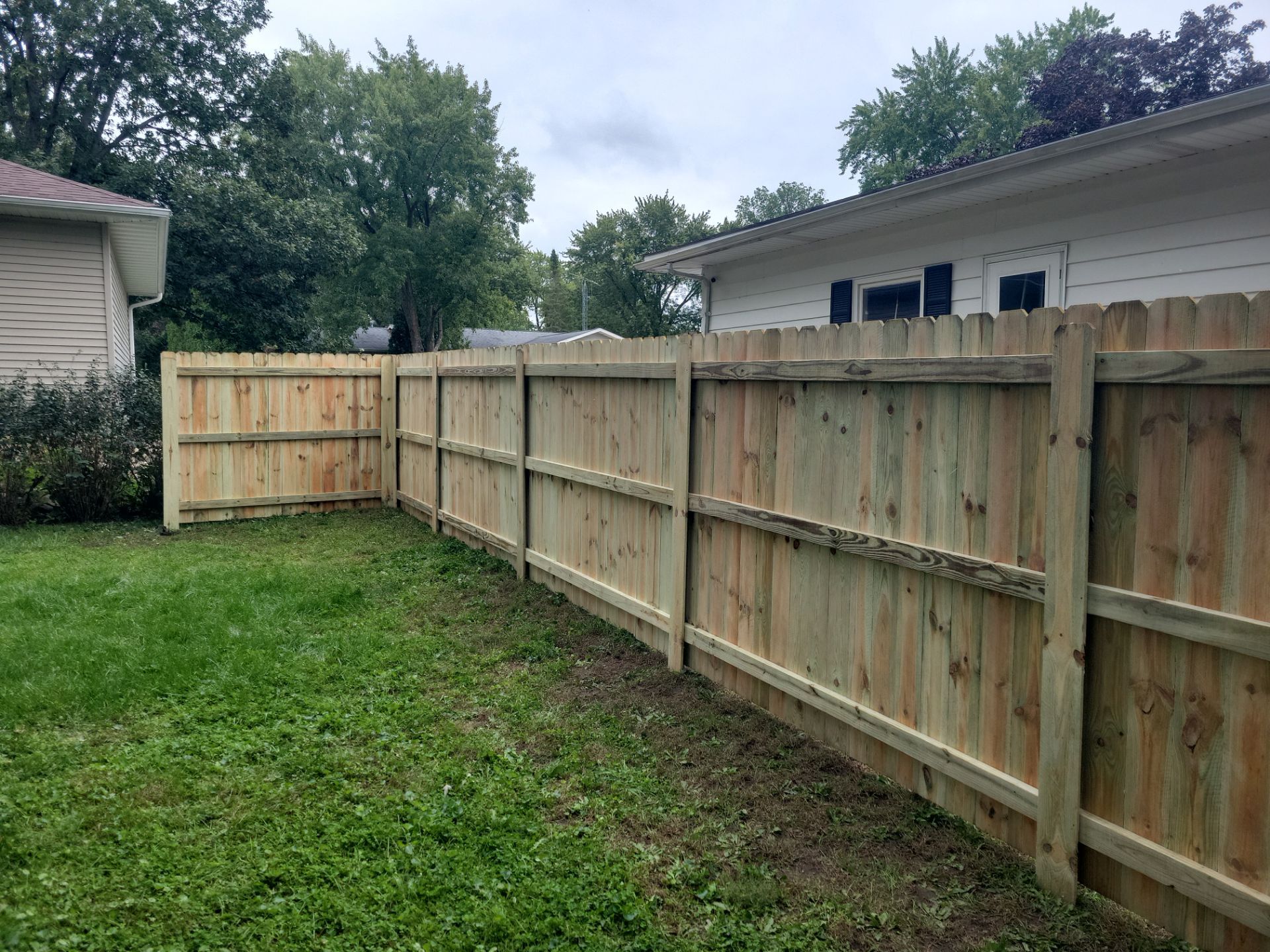 Pressure-Treated Wood Privacy Fence Installation in Waverly by Perfect Picket Fence and Stain
