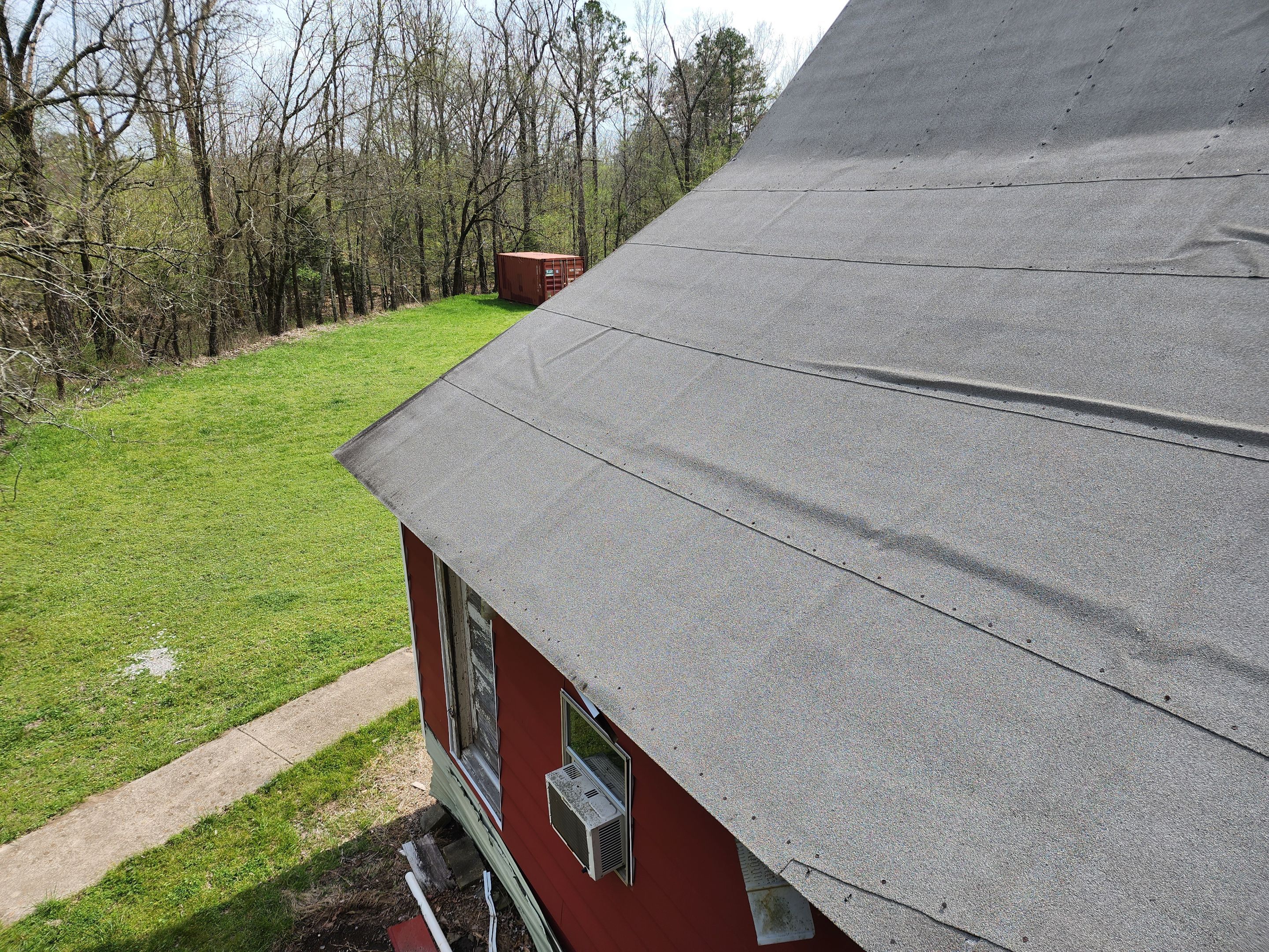 Residential Roofing Installation using 26 Gauge Colored Panels by Hostetler Roofing