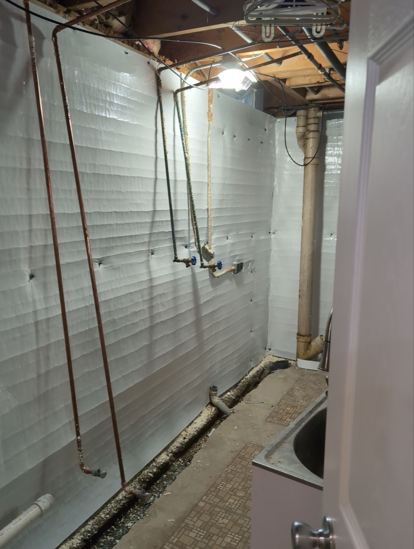 Interior Basement Waterproofing System and Egress Window Installation by Toledo Basement Repair 