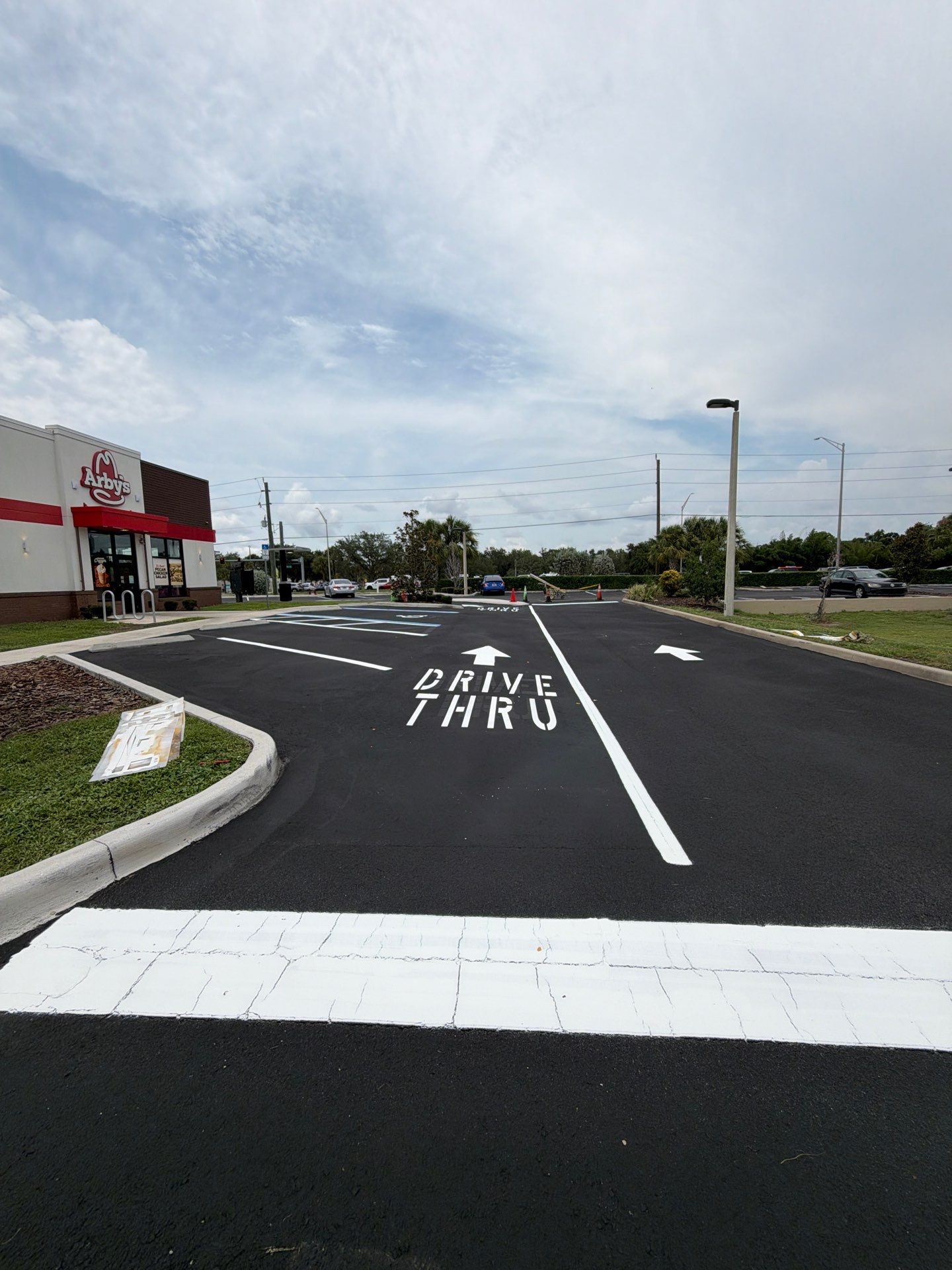 Commercial Asphalt Sealcoating and Line Striping at School House Plaza by Everline Coatings & Services - Southwest FL