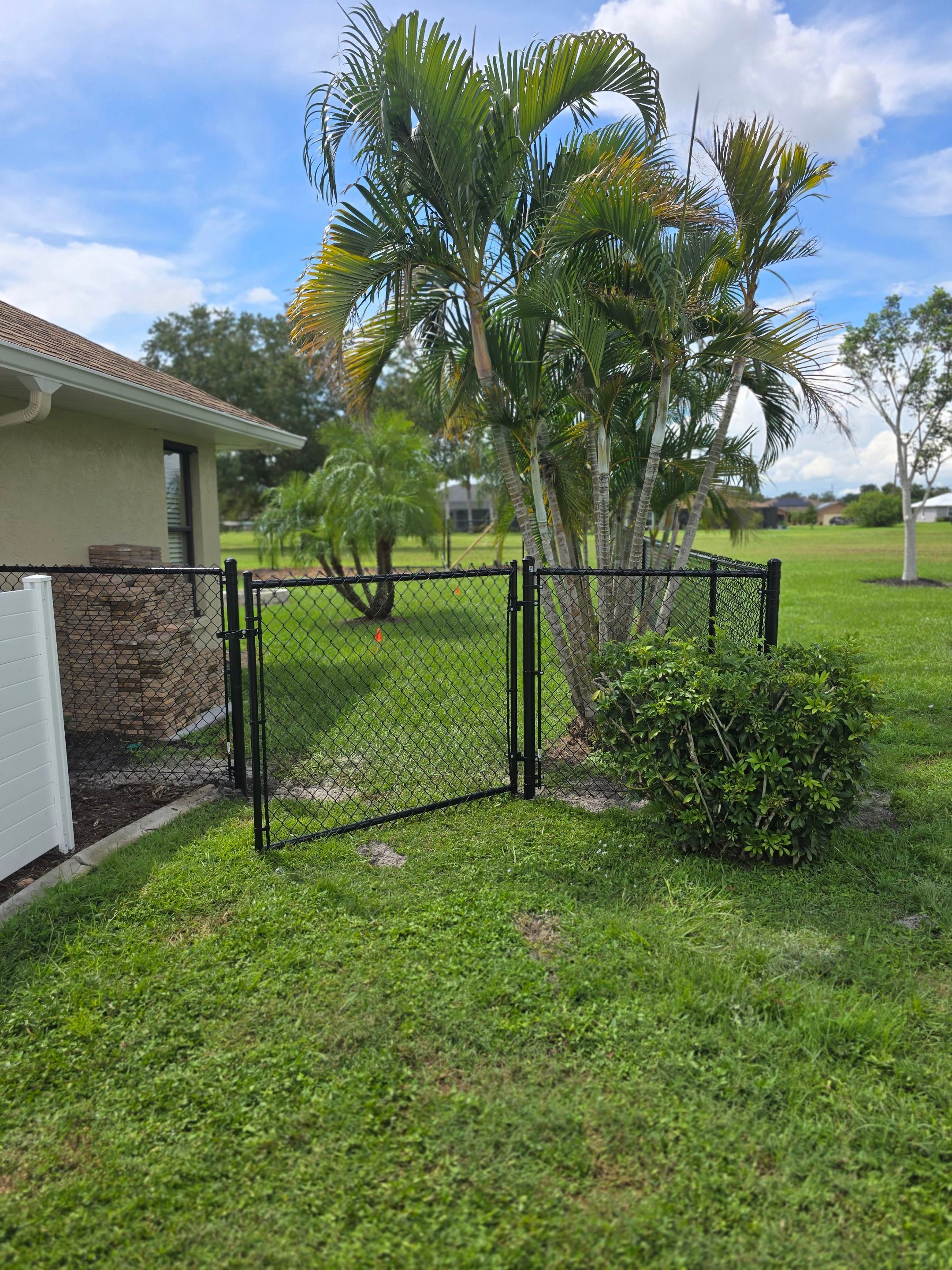 Black Vinyl-Coated Chain Link Fence Installation in Punta Gorda by True Fence LLC